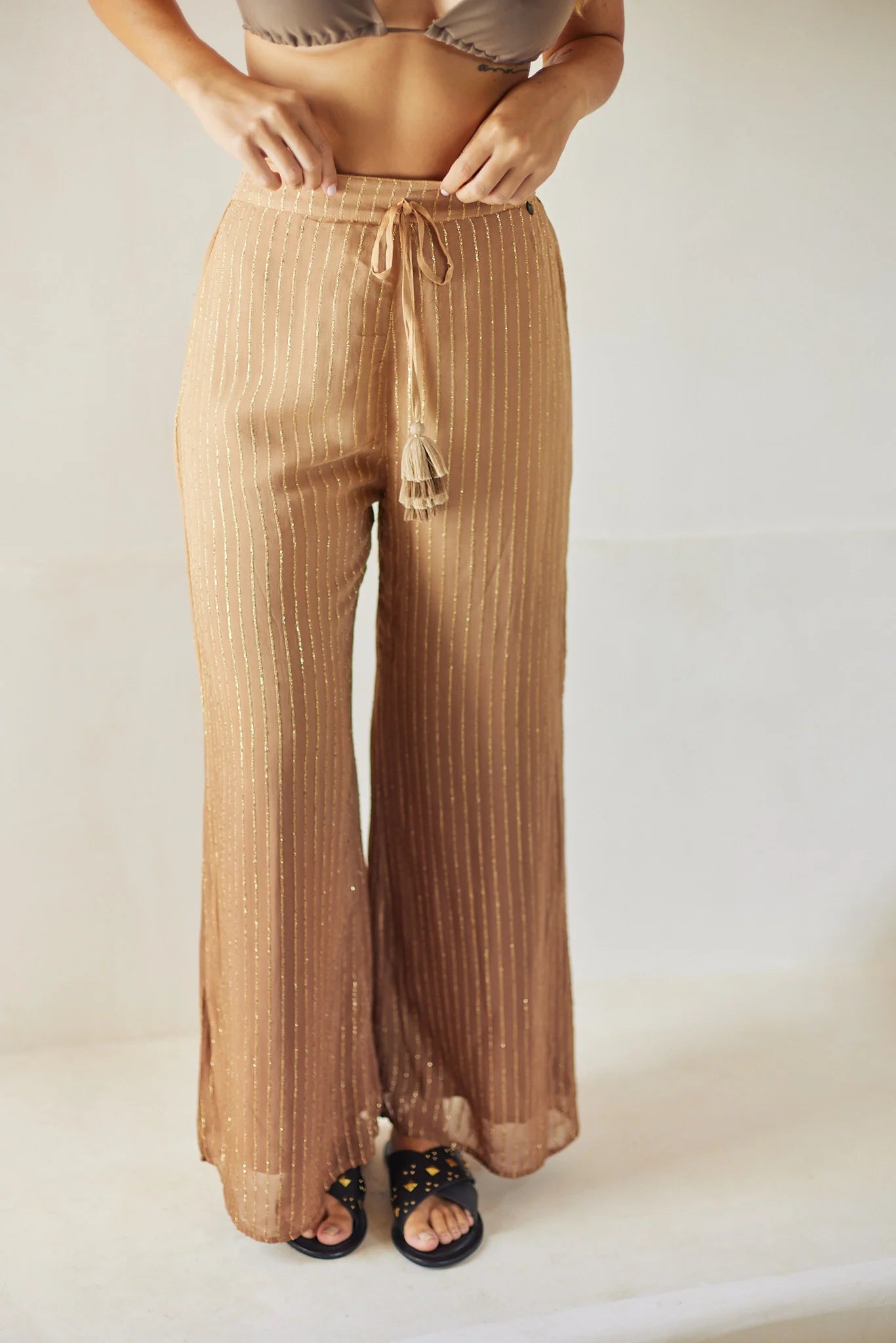 Long flowy pants with elastic waistband and tasseled drawstrings