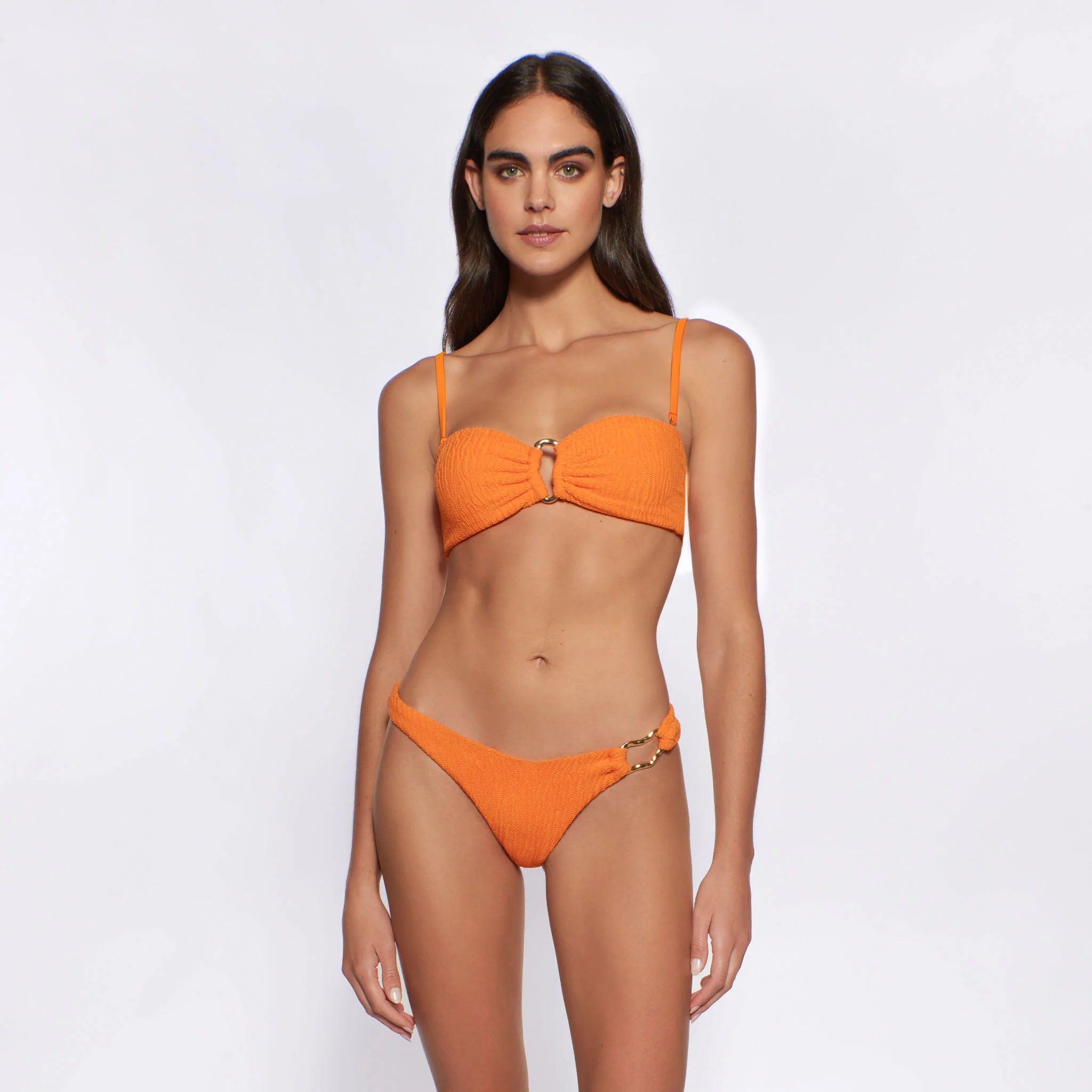 Textured bandeau with gold hardware in the front and removable straps in orange