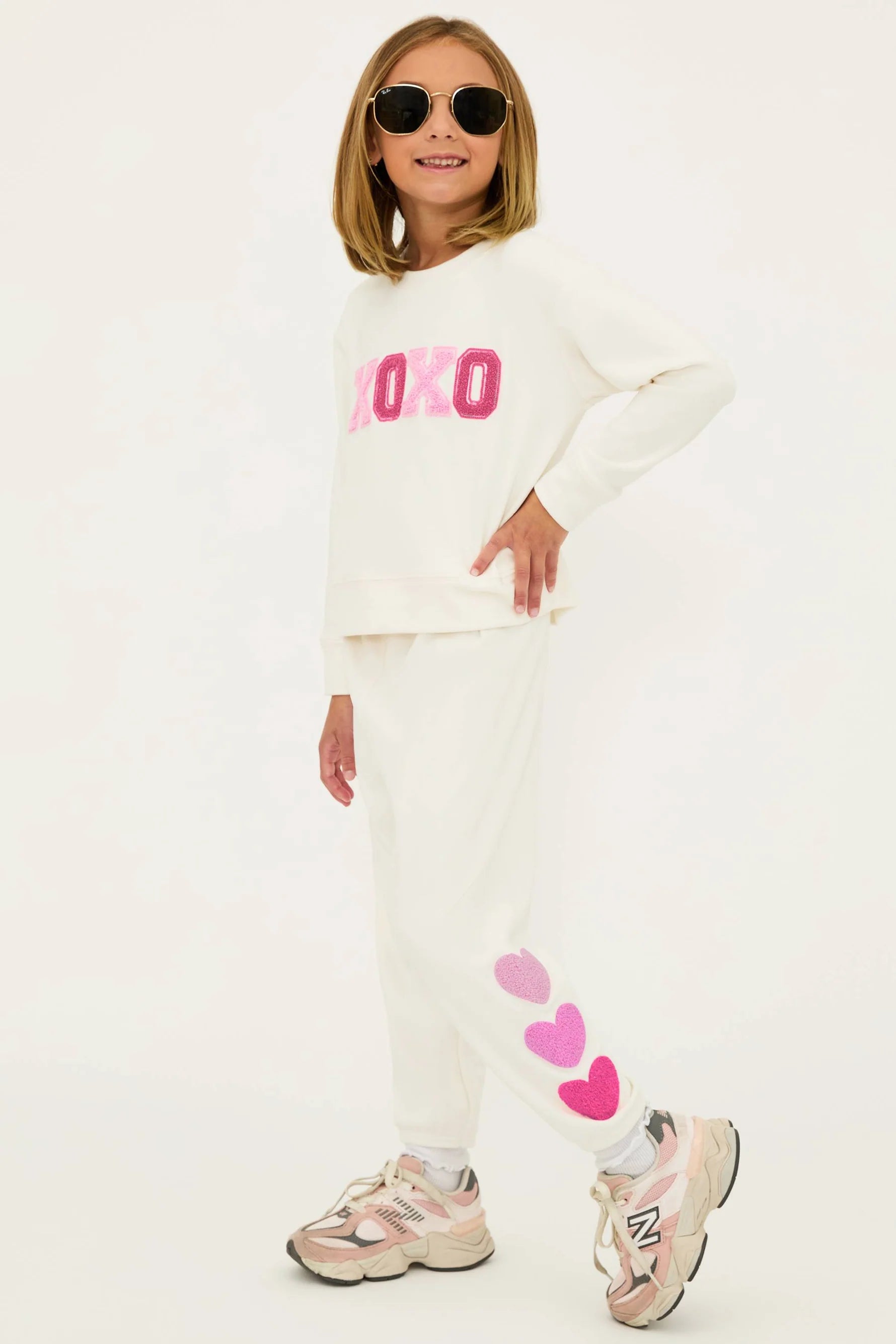 Girl's sweatpants with hearts down the left side in cream