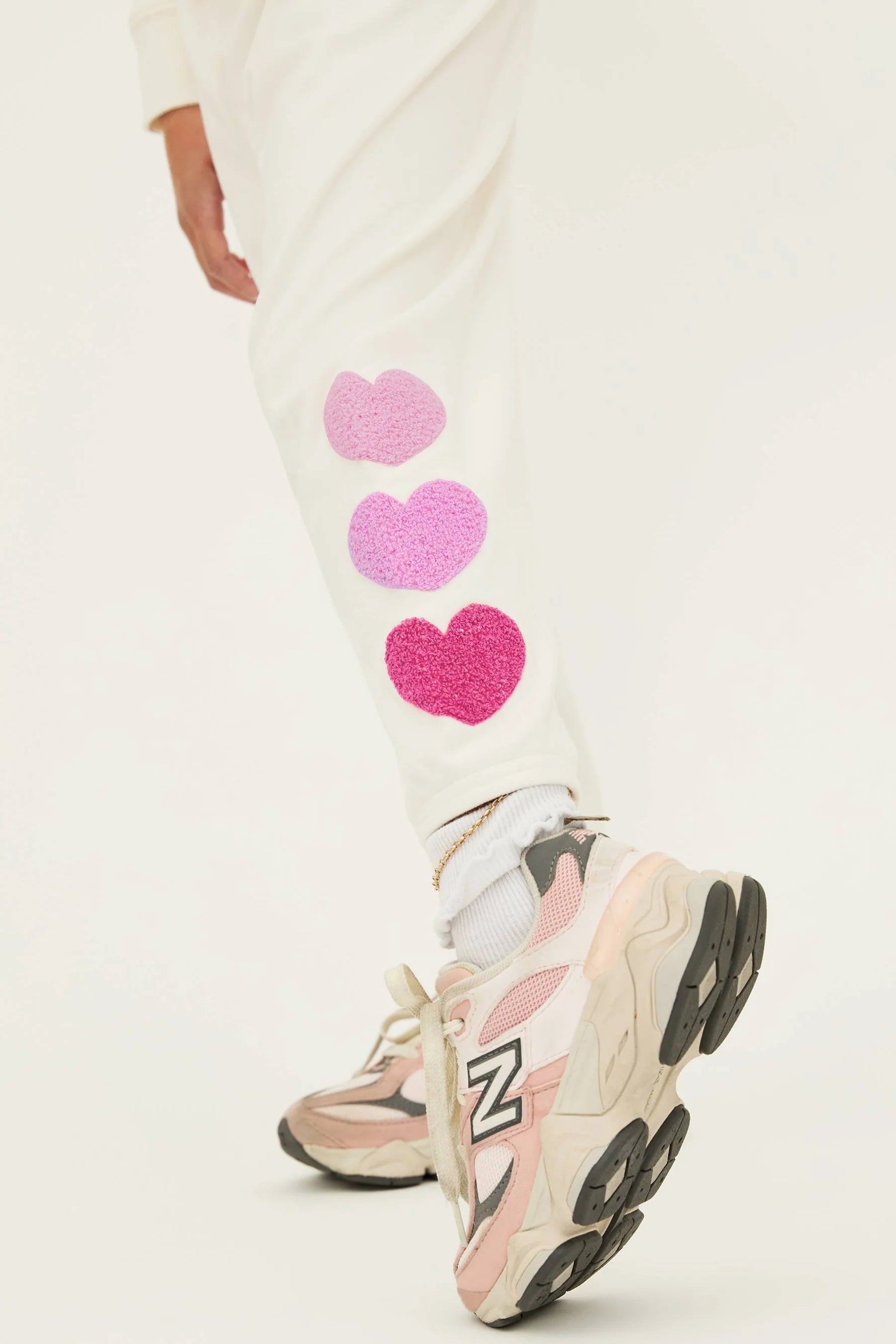 Girl's sweatpants with hearts down the left side in cream