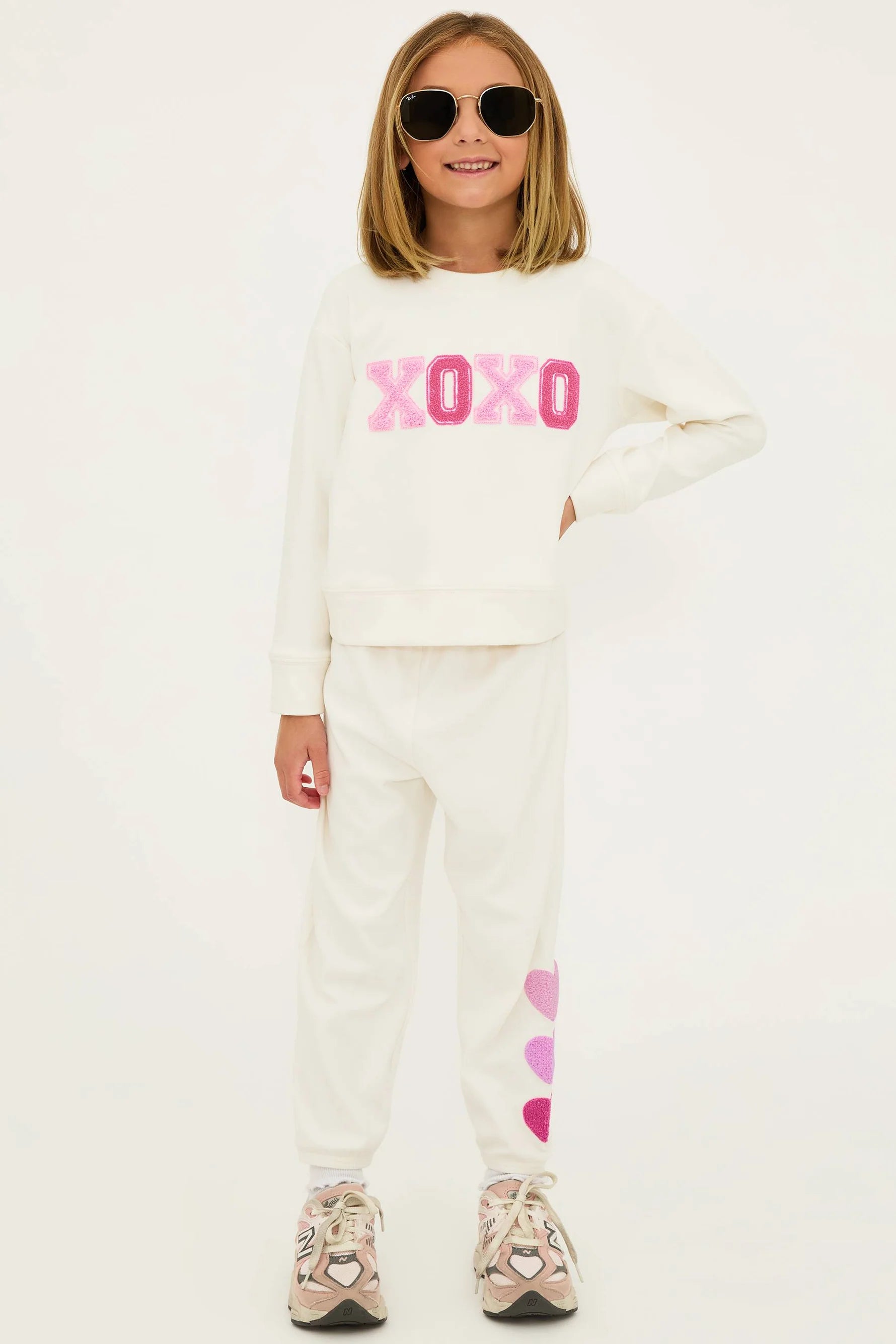 Girl's sweatpants with hearts down the left side in cream