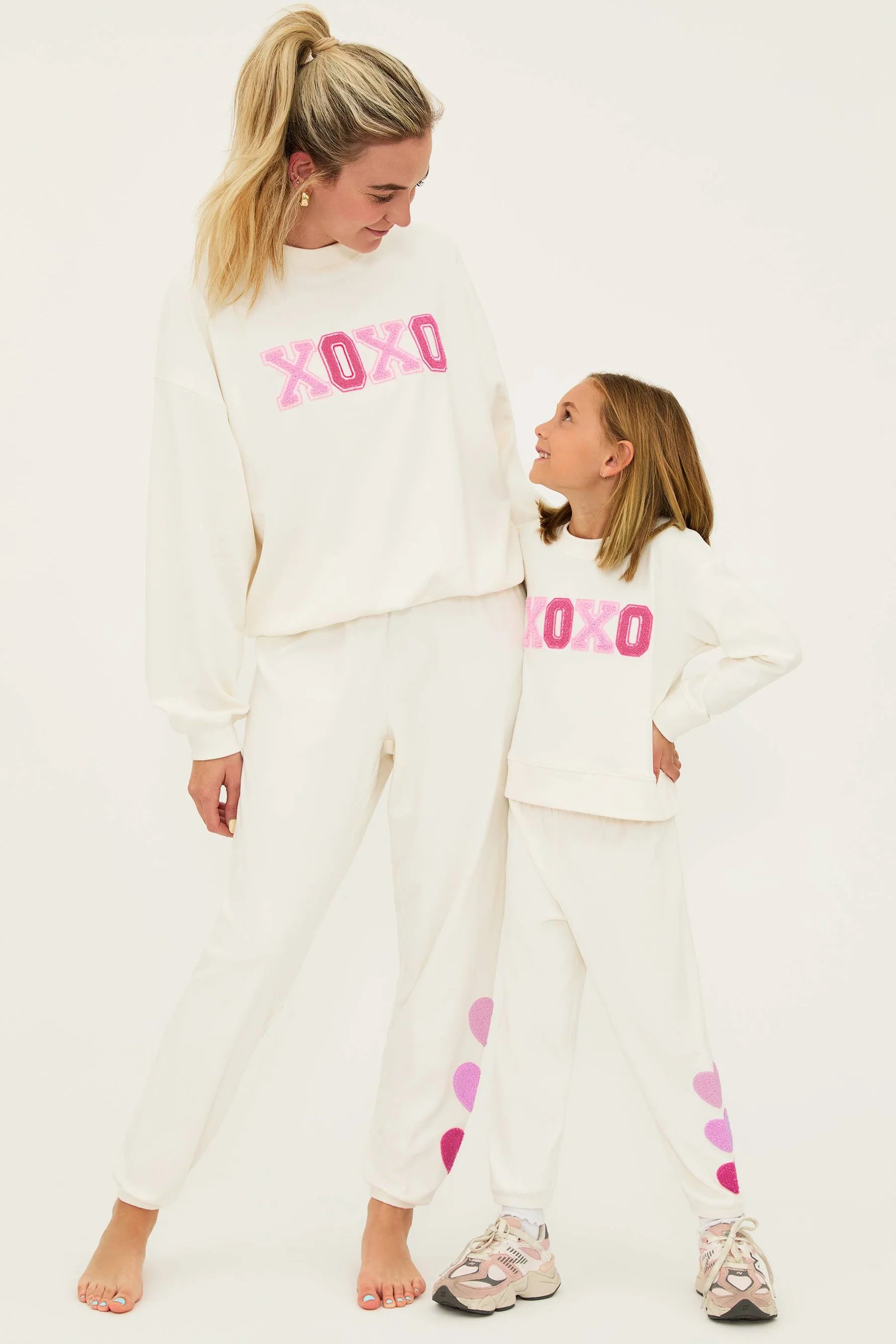 Girl's sweatpants with hearts down the left side in cream