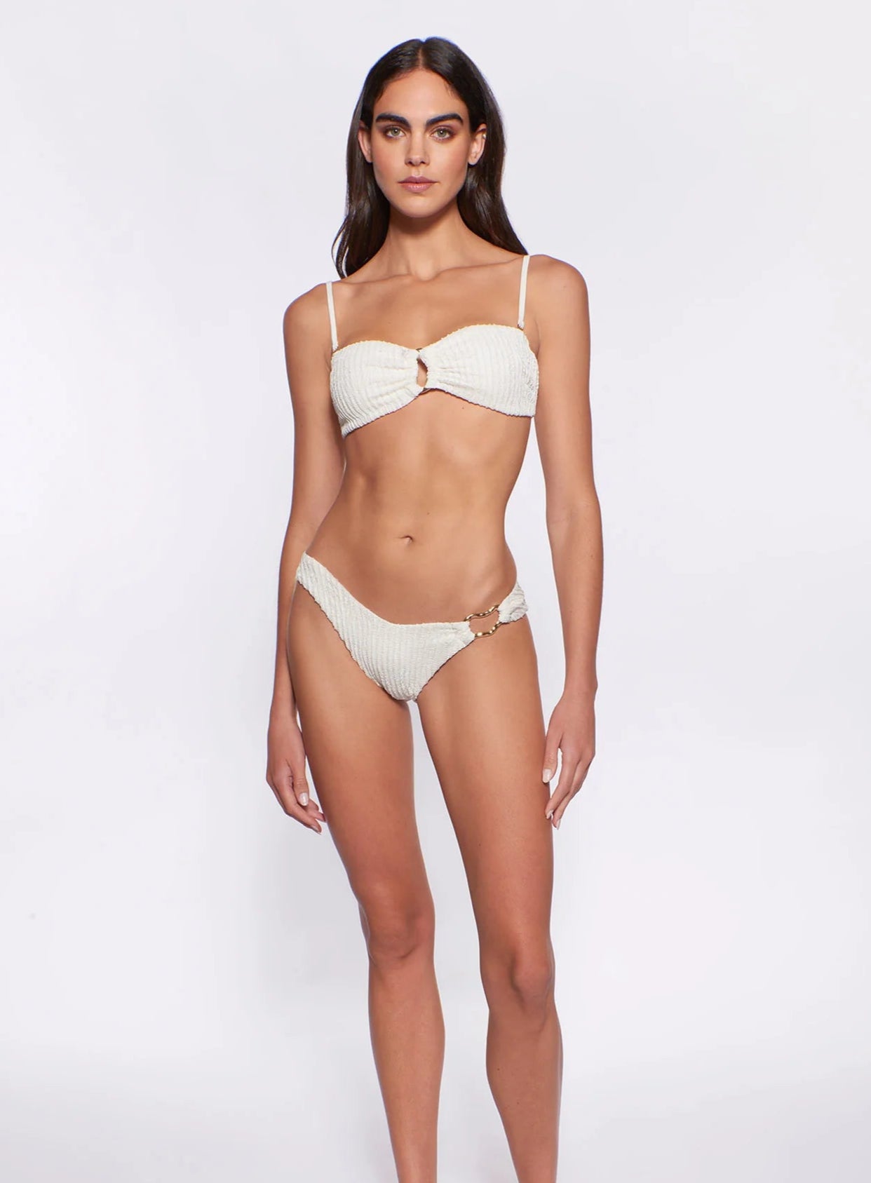 Textured bottom with gold hardware on the front left side in ivory