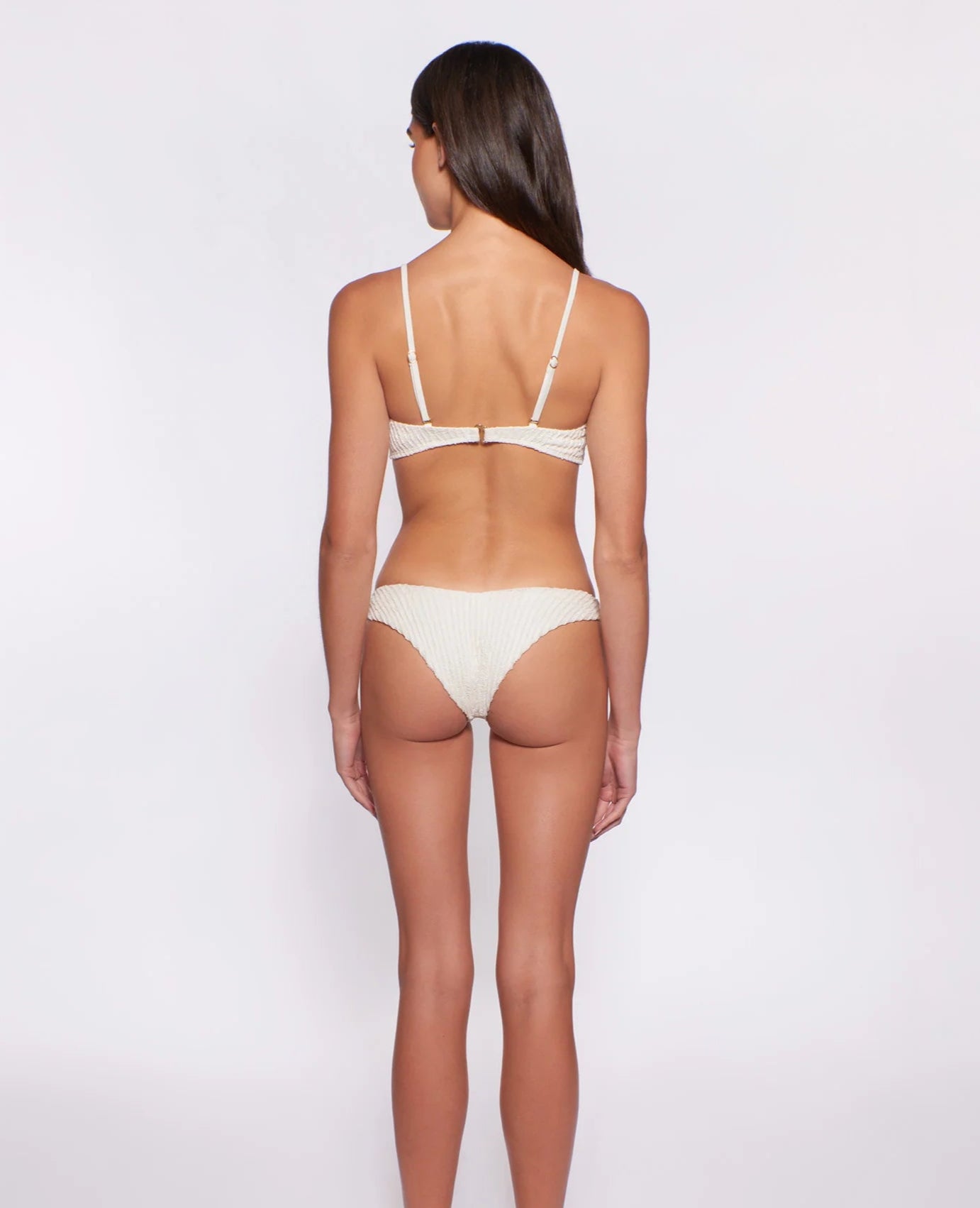 Textured bottom with gold hardware on the front left side in ivory