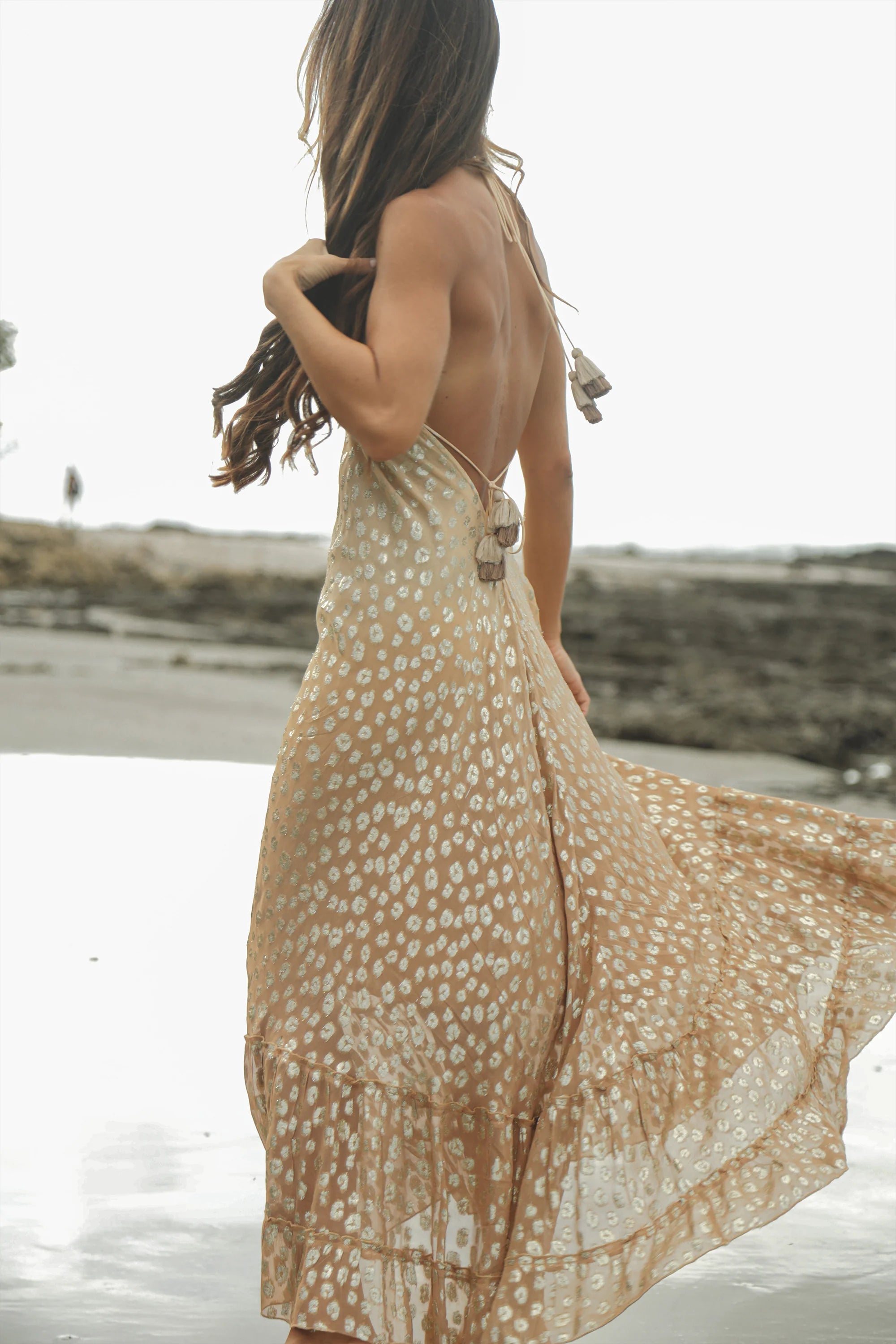 Maxi dress with tasseled halter ties and a plunging neckline