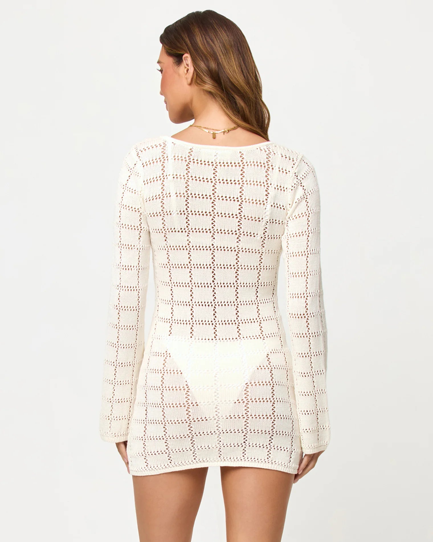 Open knit cotton mini dress with long sleeves and a plunging neckline