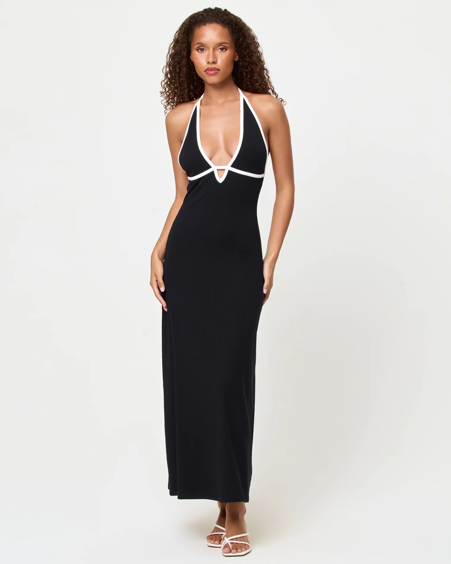 Black dress with plunging neckline and white trim