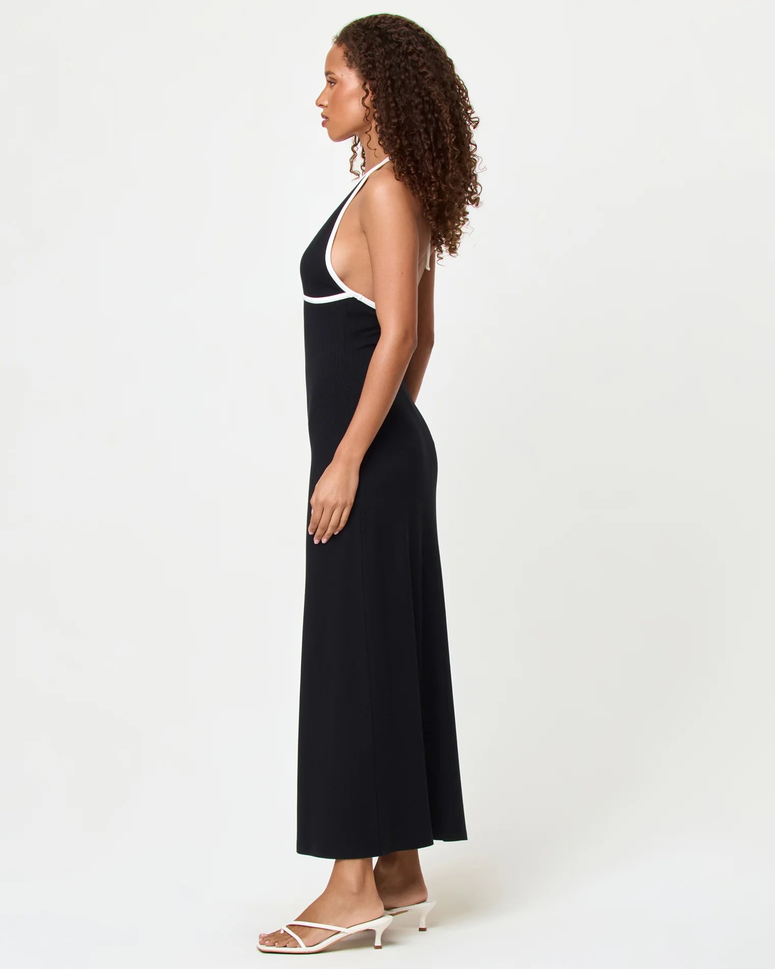 Black dress with plunging neckline and white trim