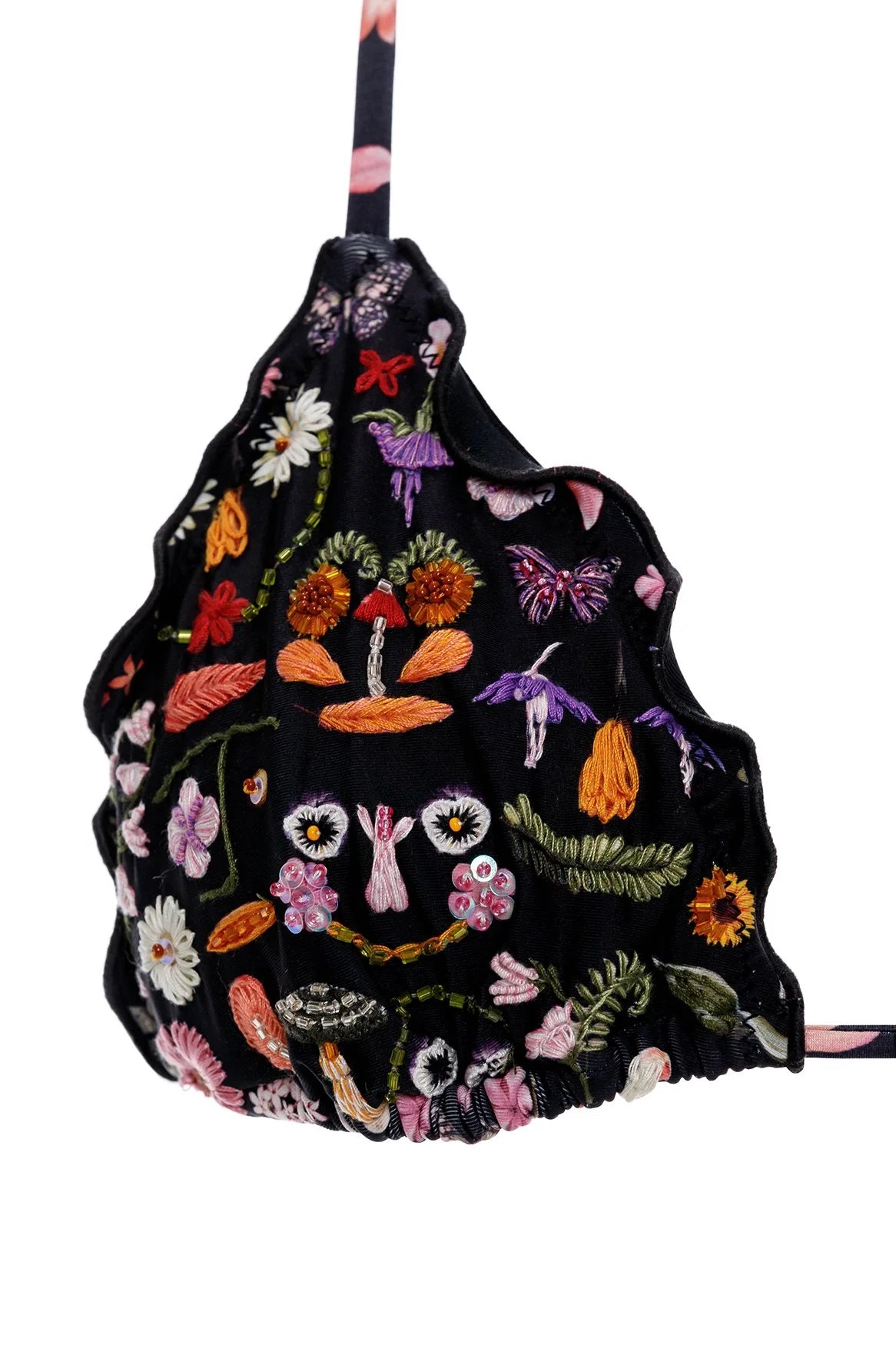 Adjustable triangle top with ruffled edges and a tie around the neck. Featuring floral print and beaded embellishment.