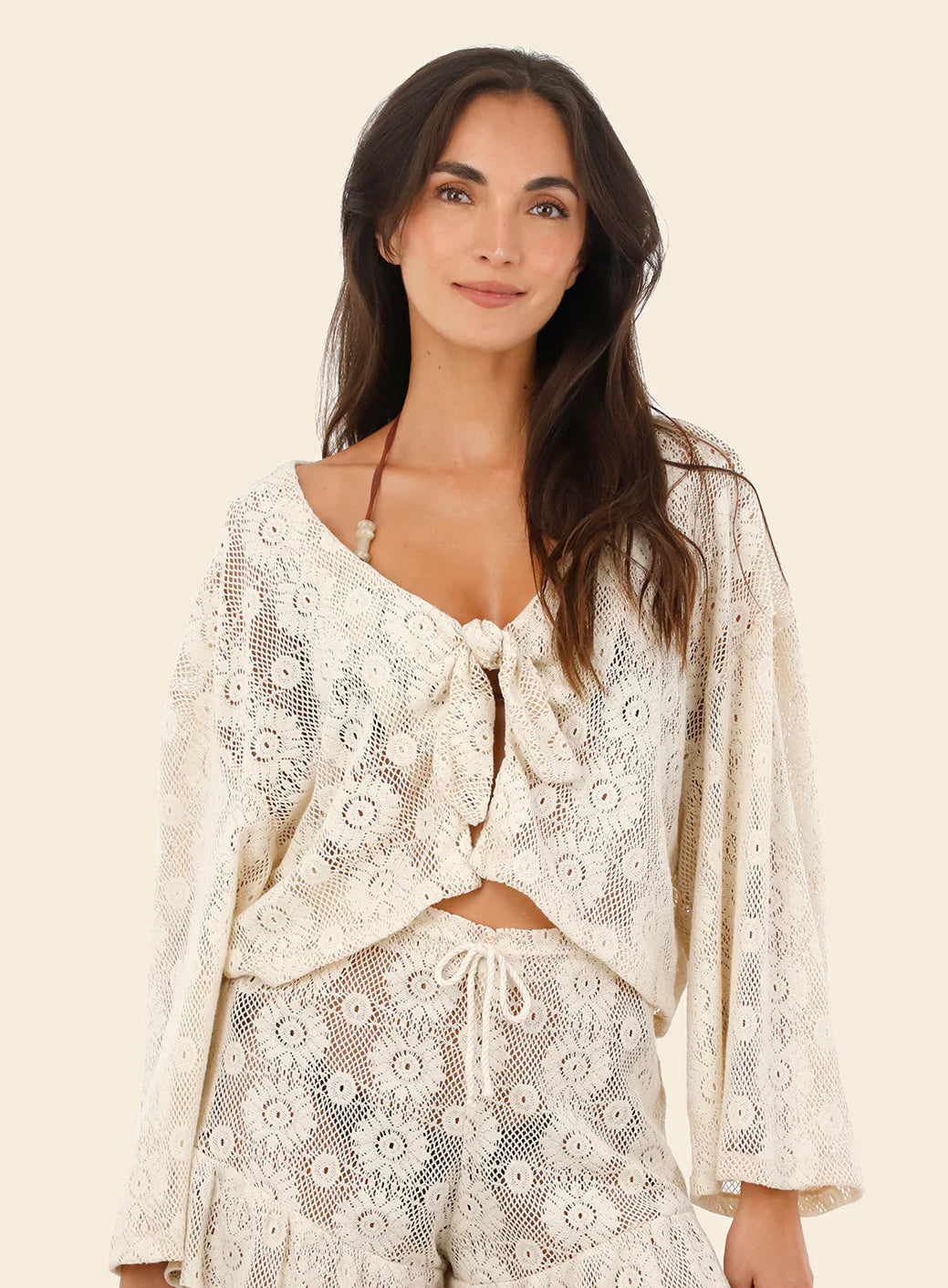 Long sleeve open knit crop top with a tie front