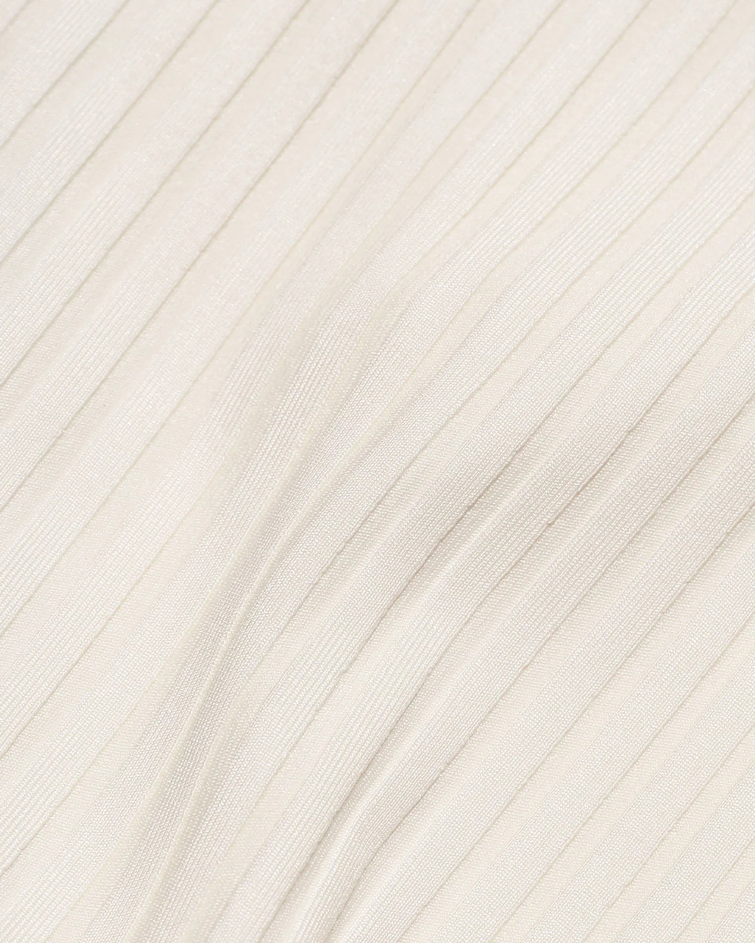 Ribbed top shirred in the front with wide shoulder straps in cream