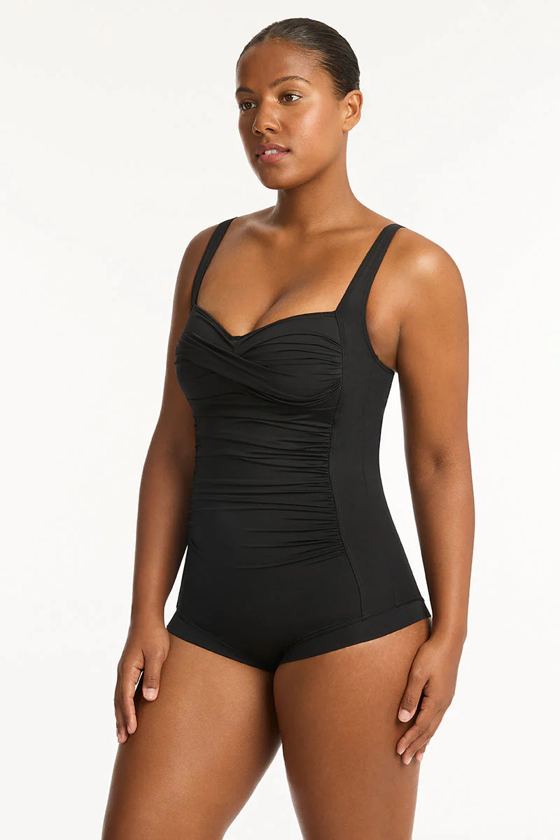 Full coverage black one piece with soft cup support and boyshort coverage in the back