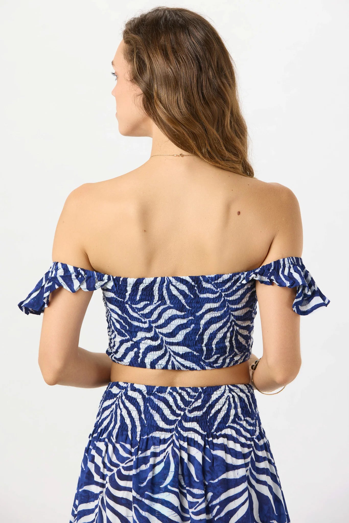 Smocked crop top with ruffle straps in navy print