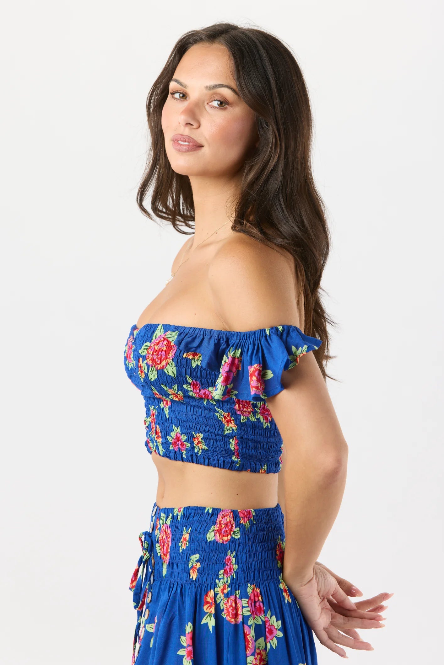 Smocked crop top with ruffled sleeves in blue with floral print