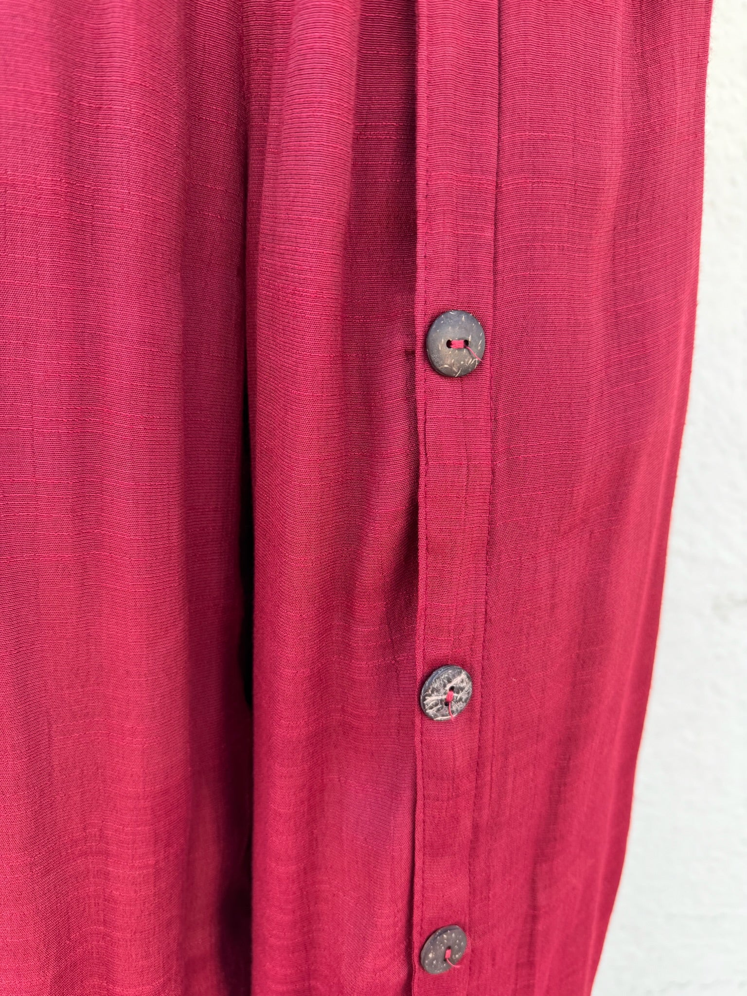 Flowy red pants with buttons down the left side