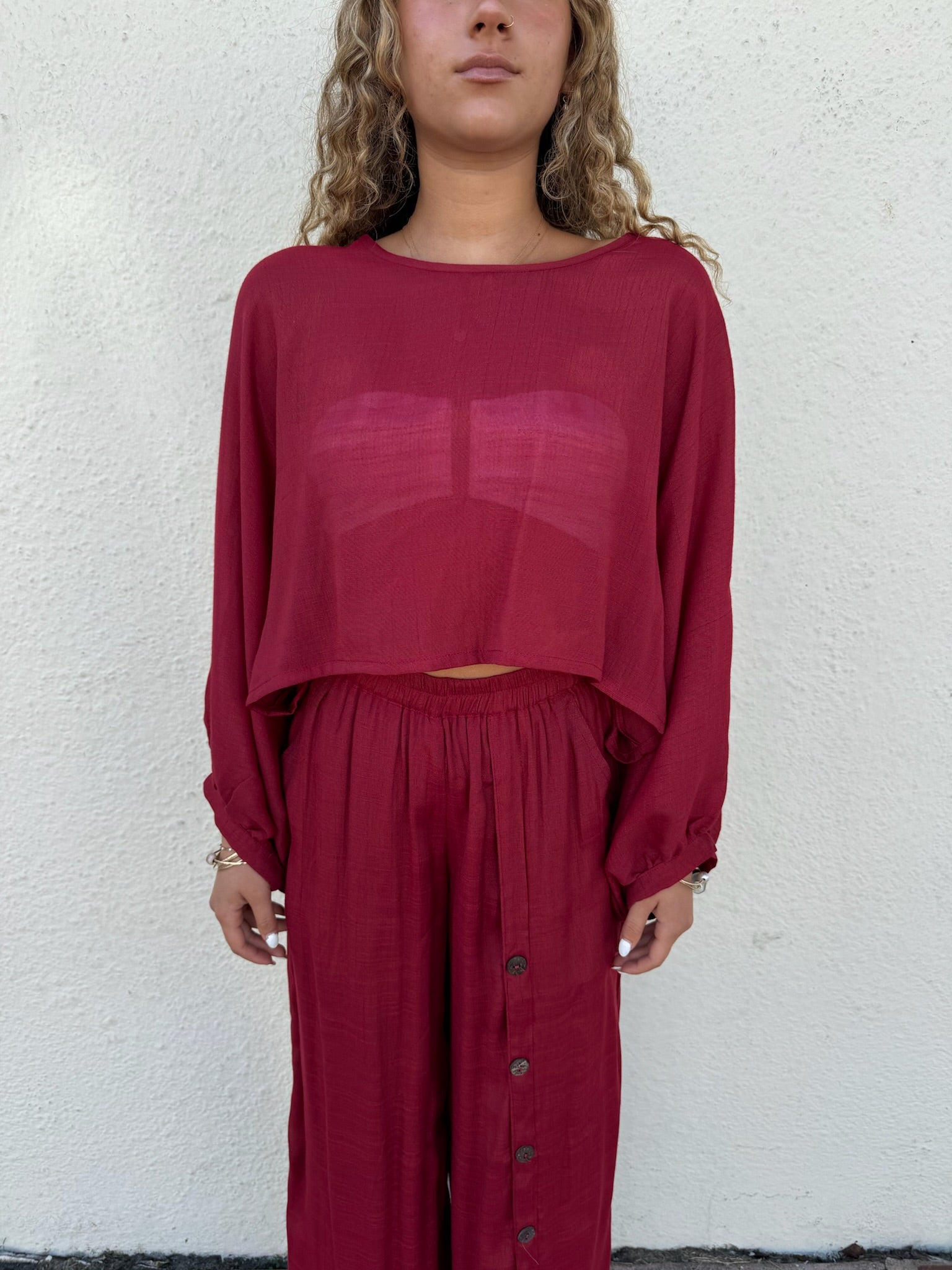 Flowy red pants with buttons down the left side
