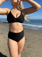 Scooped neck top with ruching in the front and a tie back in Black