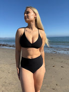 Scooped neck top with ruching in the front and a tie back in Black