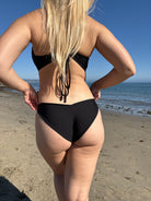 Medium coverage bottom with a ruched back in Black