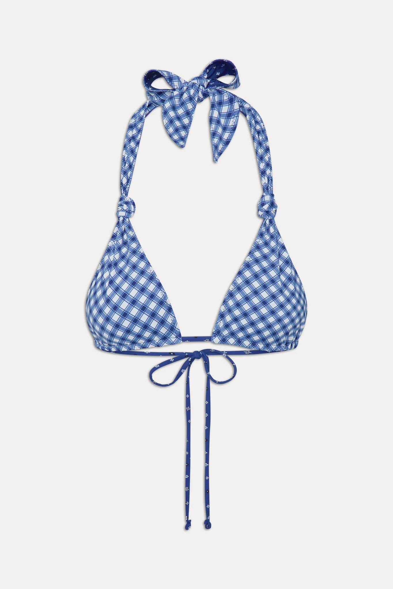 Adjustable triangle top with knotted halter ties that reverses from gingham to star print