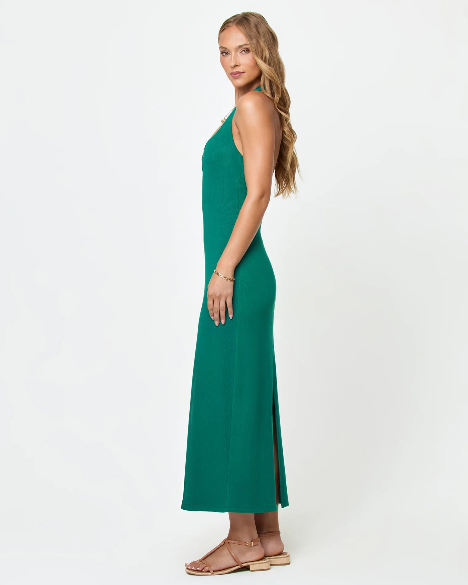 Green body hugging midi dress with a halter neckline and u bar front