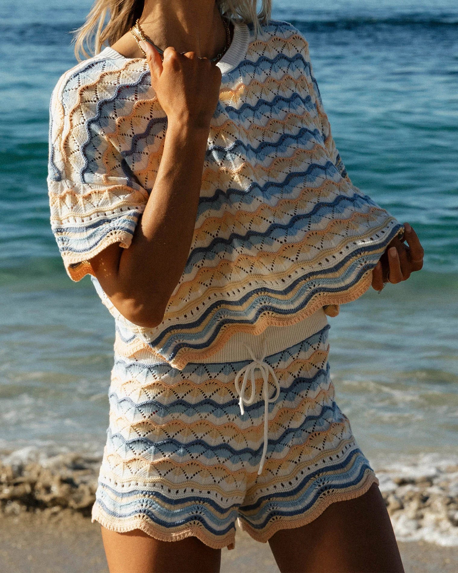 Cropped crochet cotton top with scalloped hem in multicolor striped print