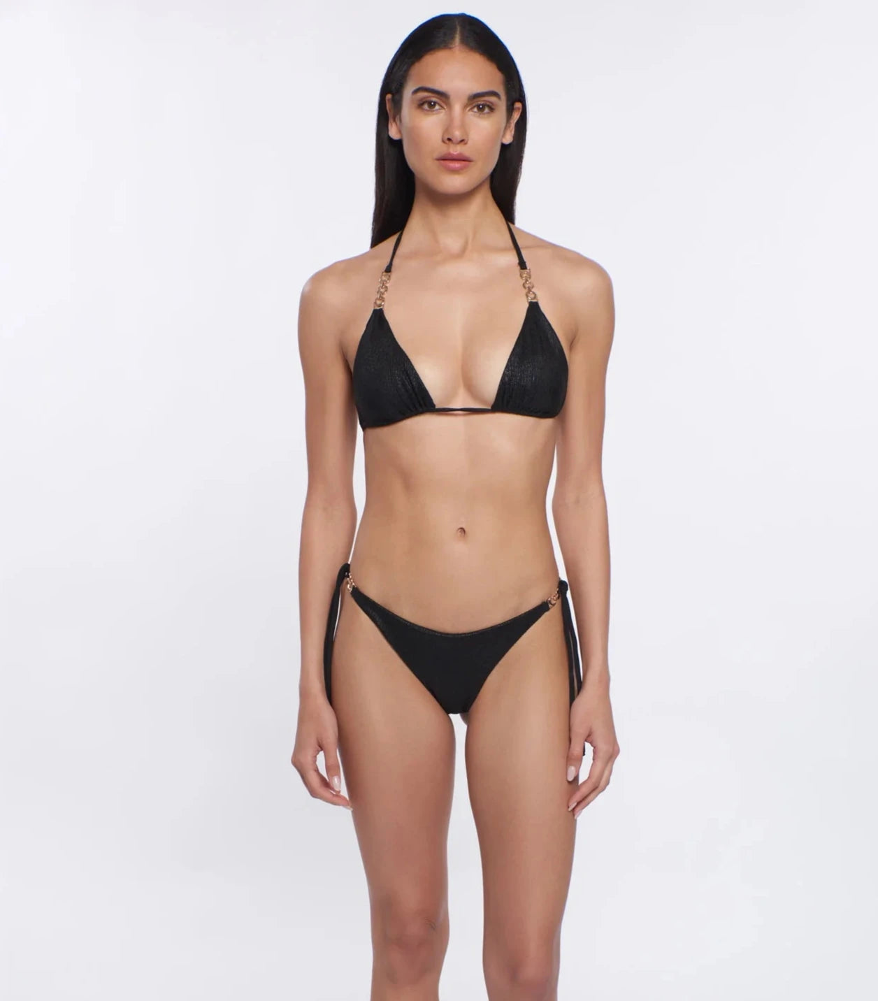 Shimmery black triangle top with gold hardware on the straps