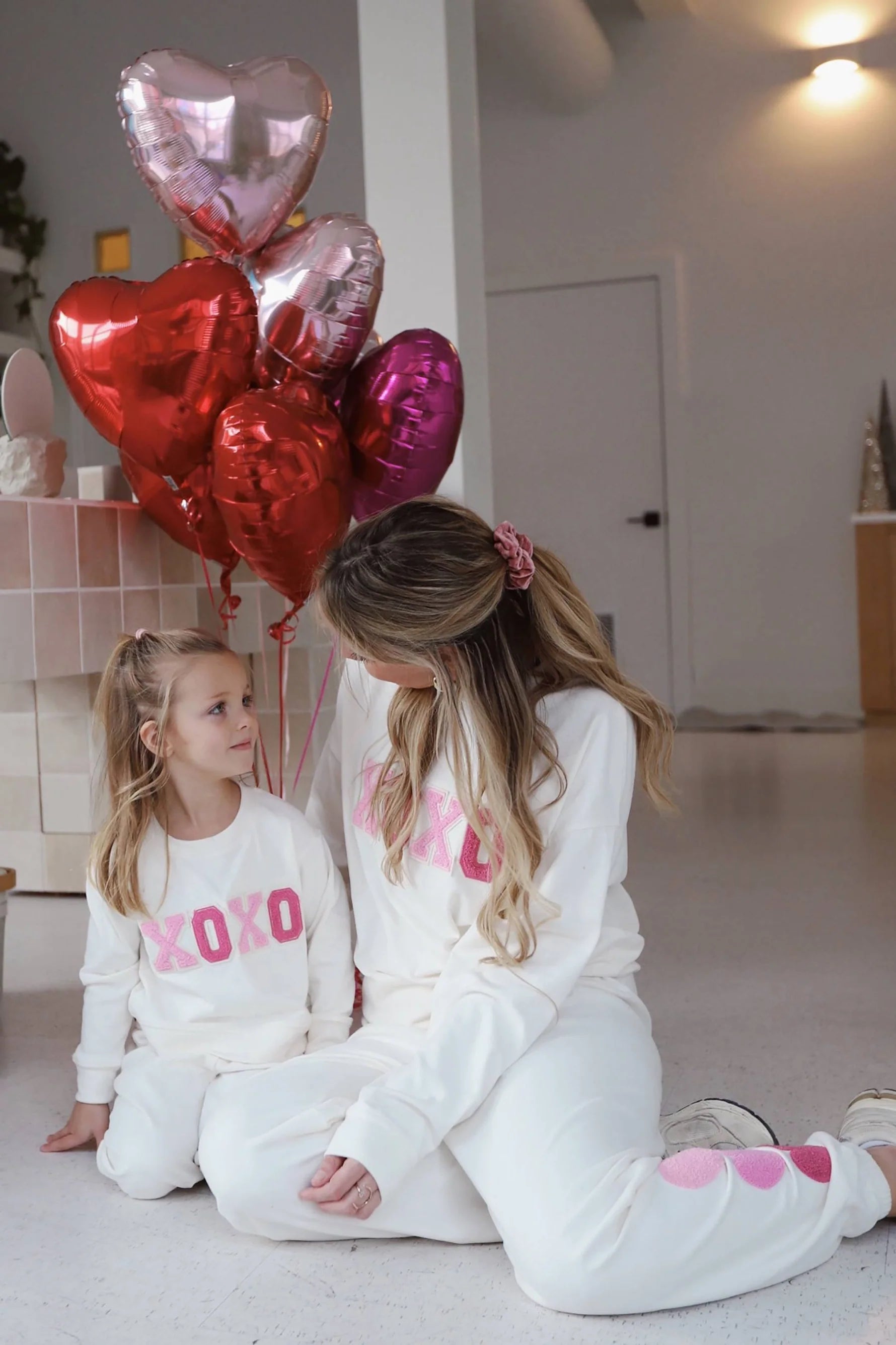 Girl's sweatpants with hearts down the left side in cream