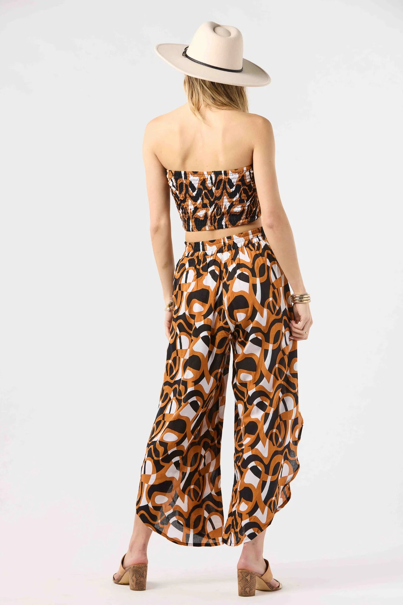 Strapless smocked crop top in brown and black print
