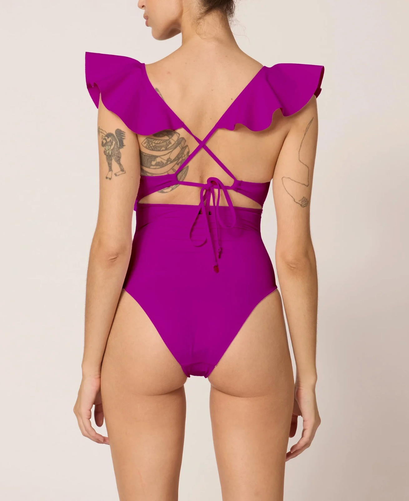 Ruffled one piece with v-wire support and a front cutout in purple