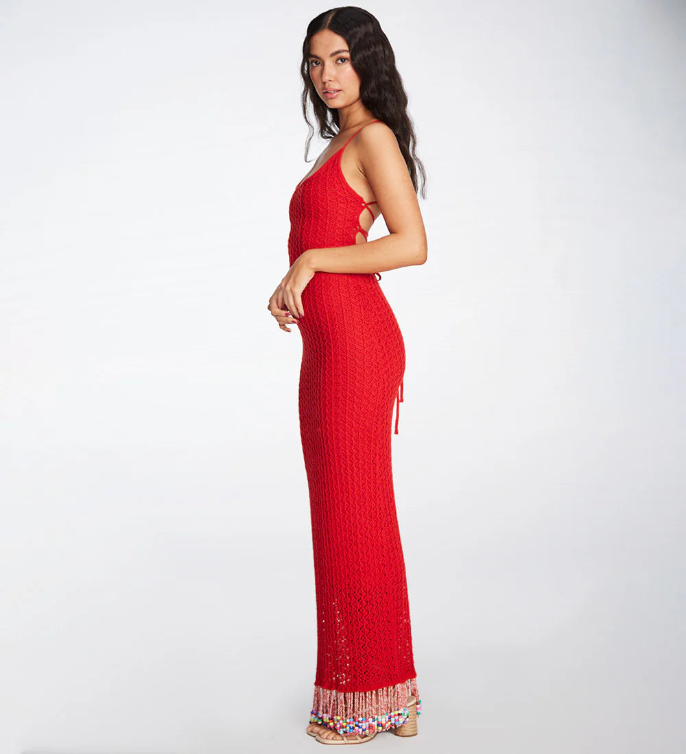 Knitted red maxi dress with multicolor beads on the bottom