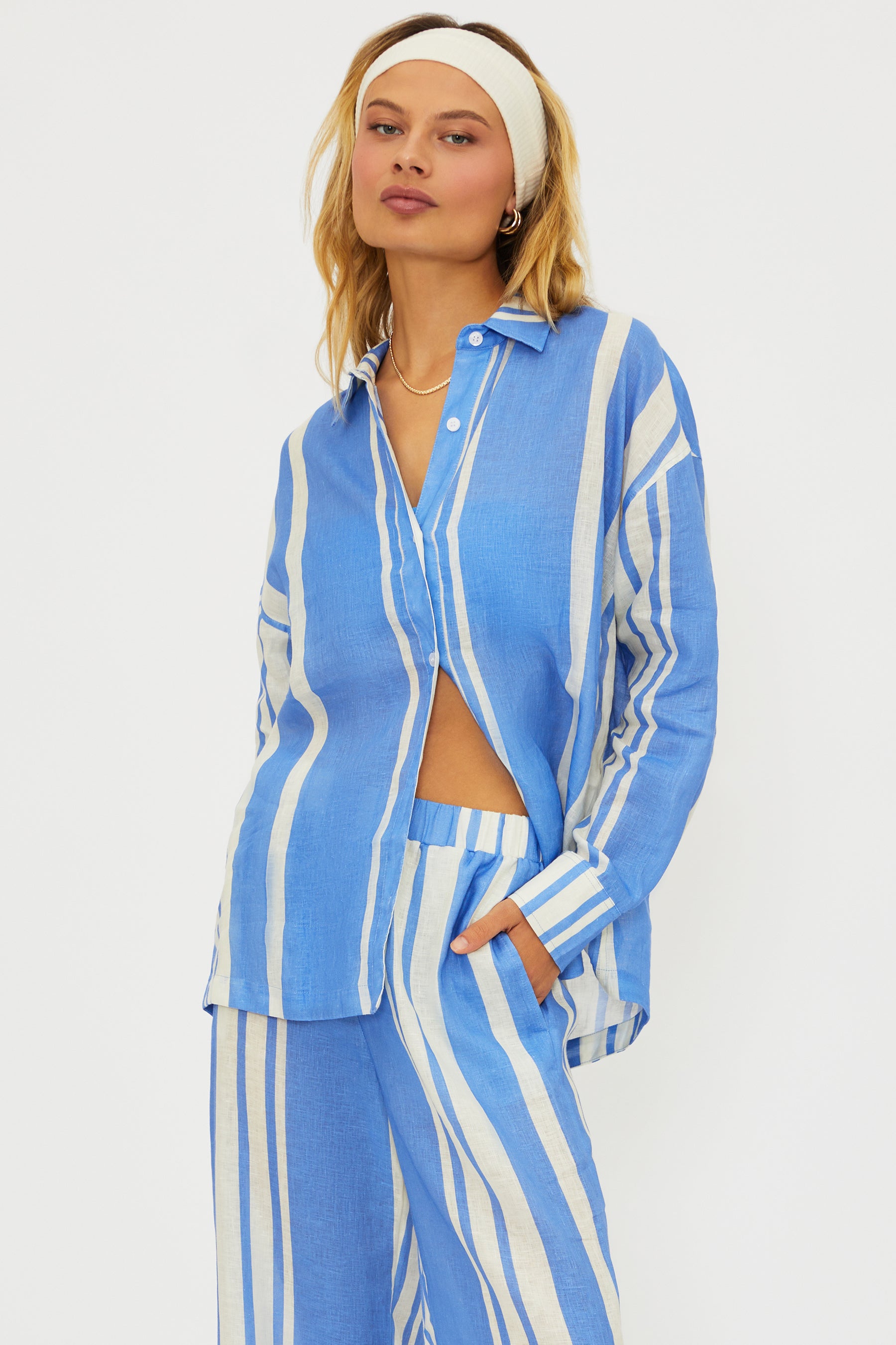 Button down linen shirt with vertical stripes and a collar.