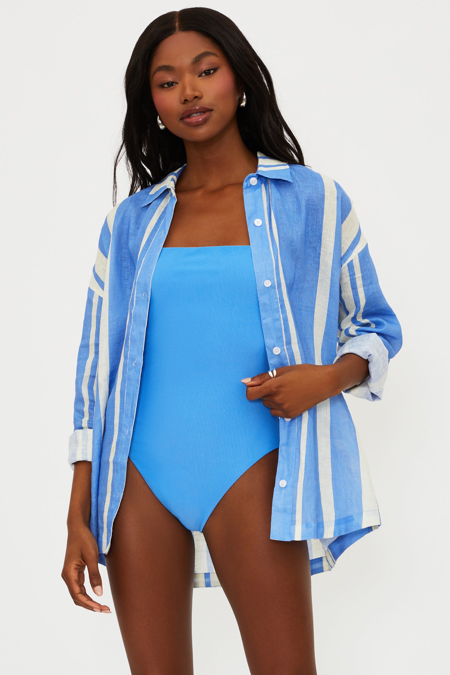 Button down linen shirt with vertical stripes and a collar.