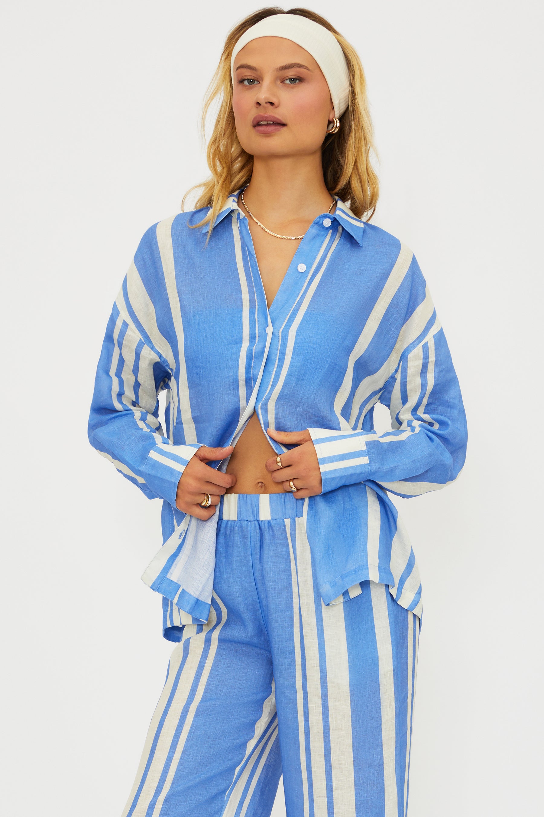 Button down linen shirt with vertical stripes and a collar.