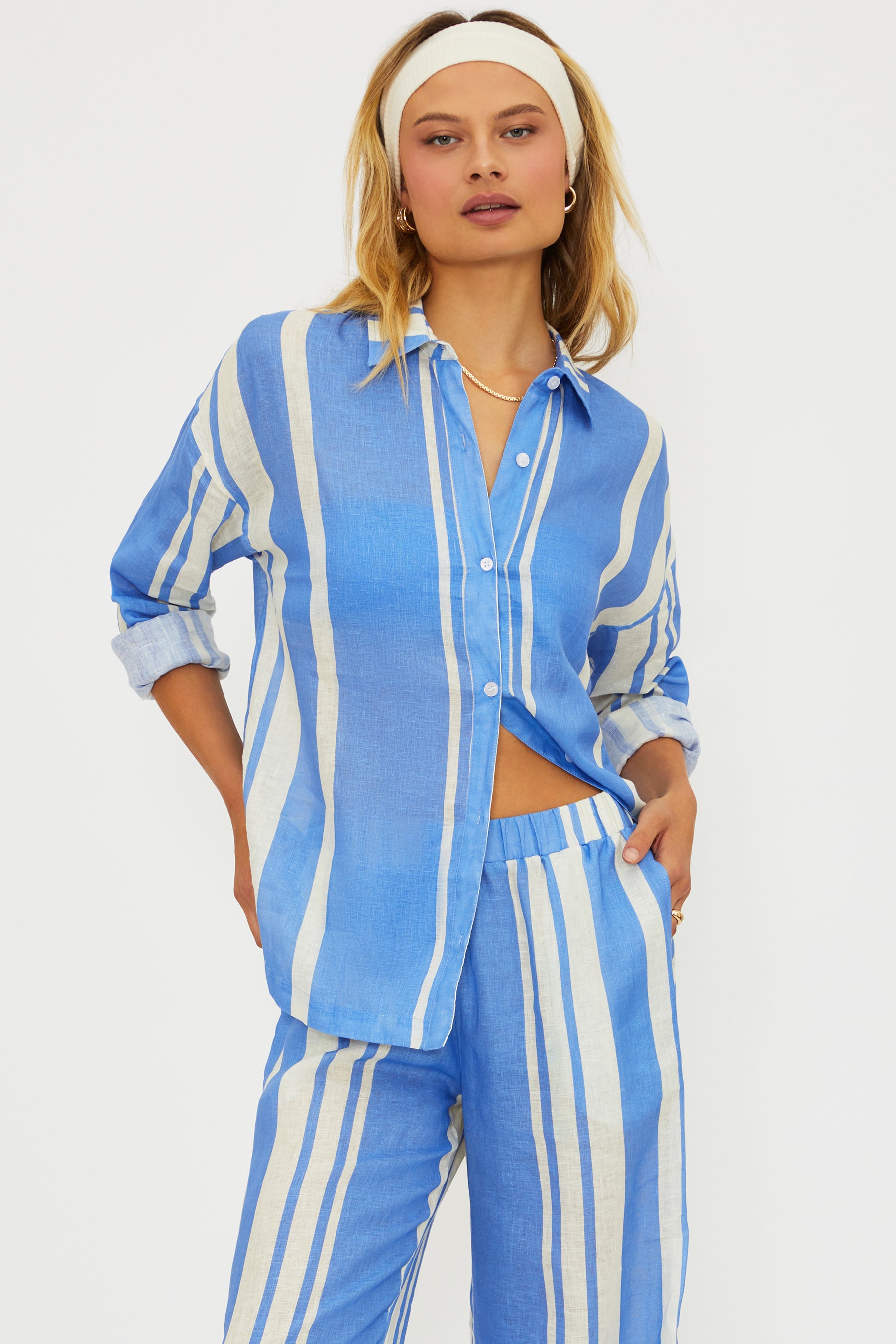 Button down linen shirt with vertical stripes and a collar.