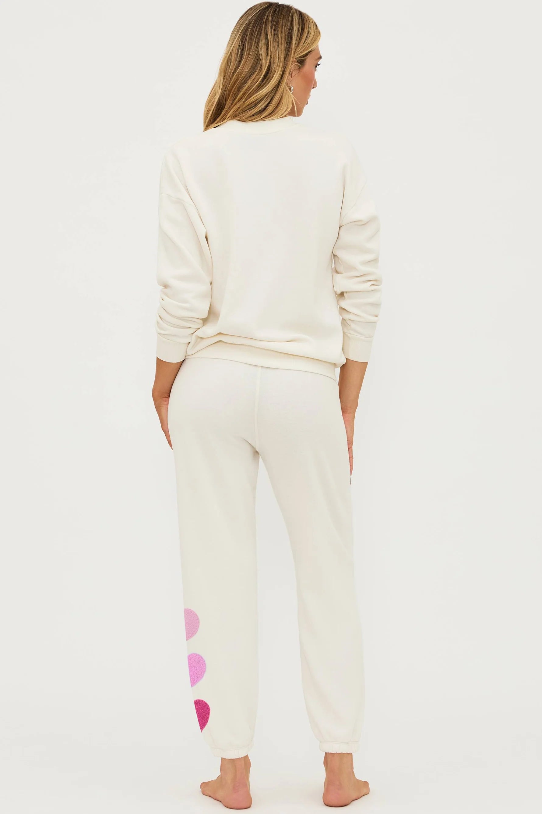 Sweatpants with hearts down the left side in cream