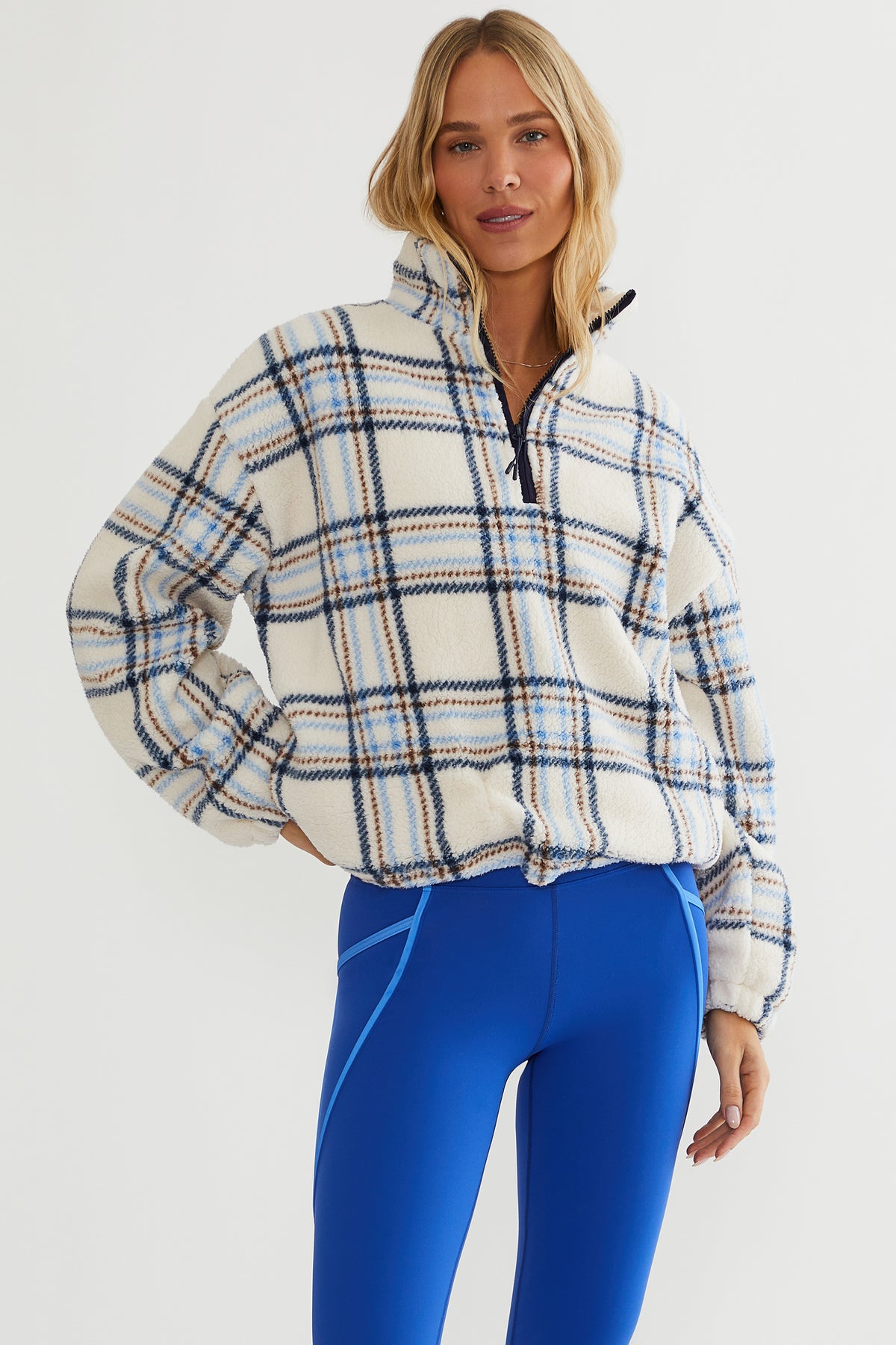 Faux fur pullover sherpa with a quarter zip neckline in plaid
