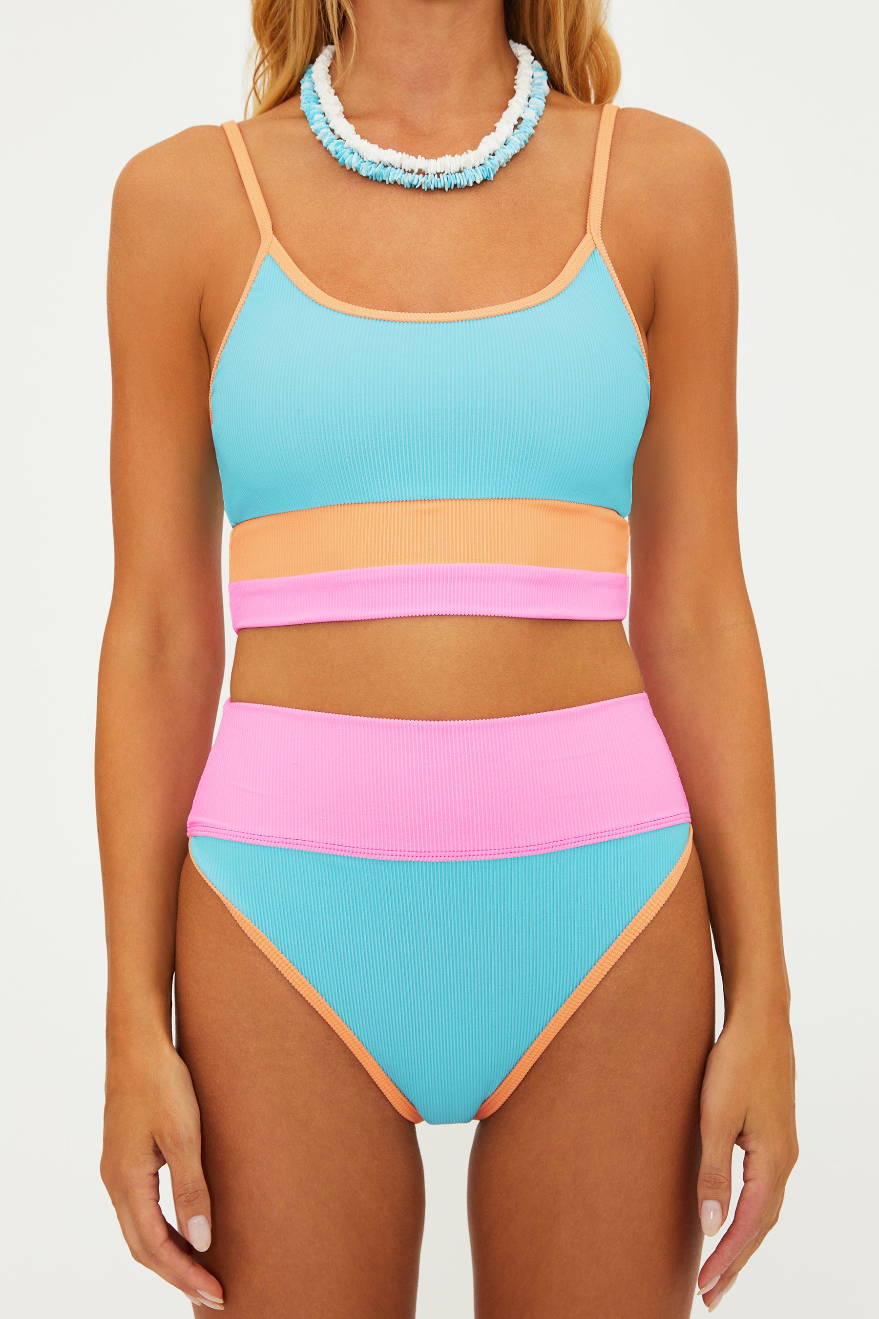 Bright multicolor top featuring a scooped neckline and adjustable straps