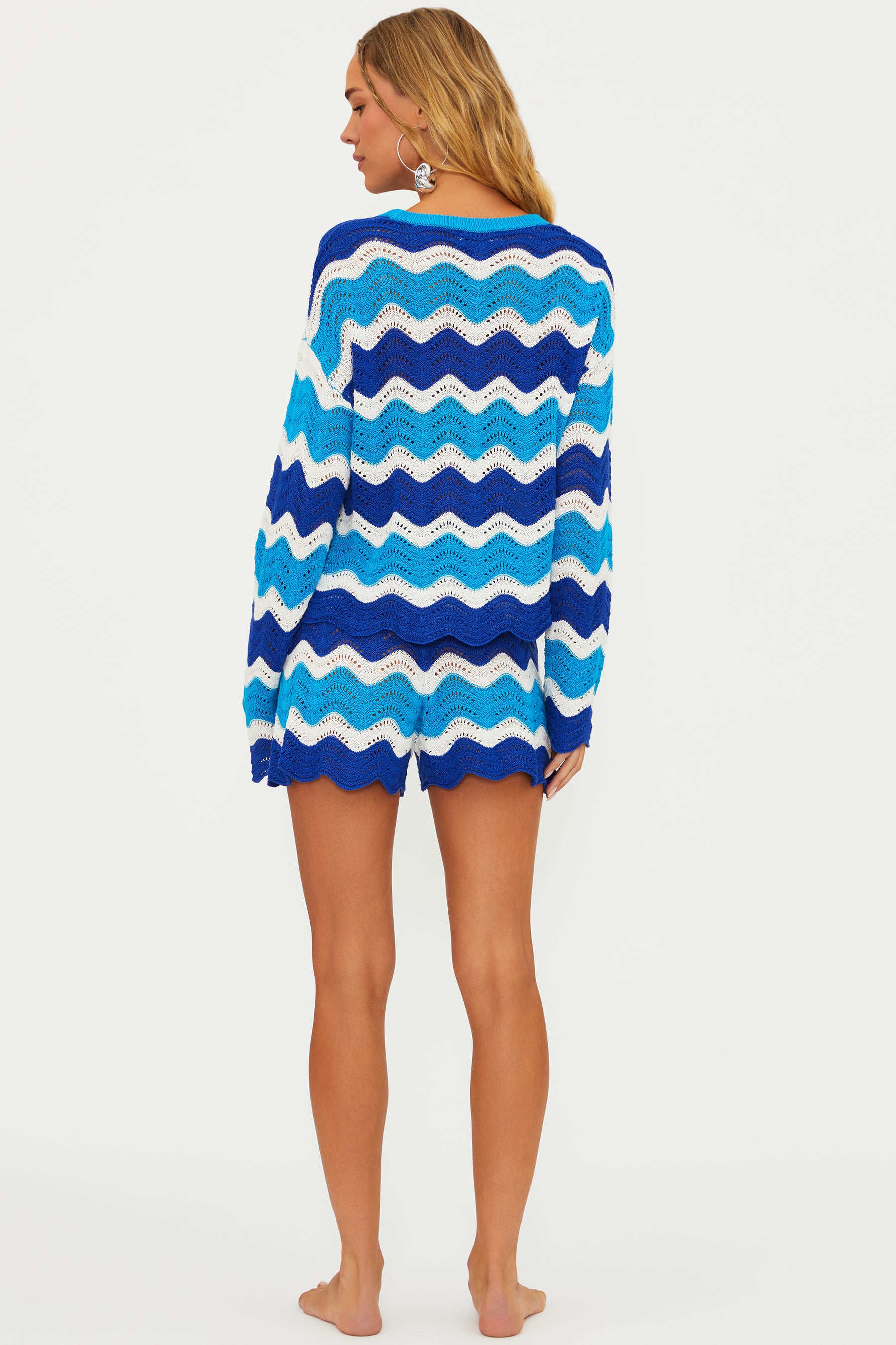 Open knit shorts with drawstring and elastic waistband in blue and turquoise wavy stripes