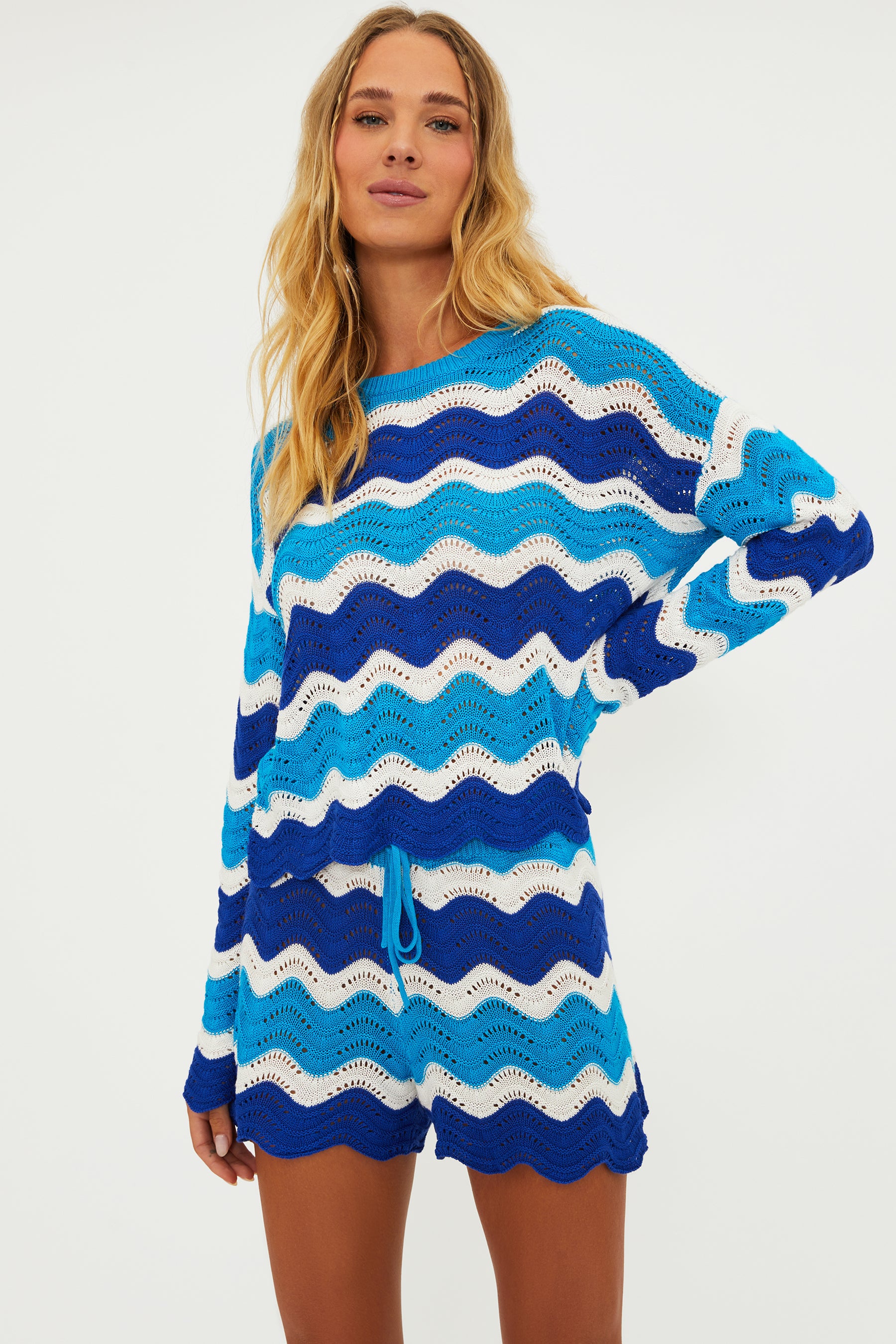 Open knit shorts with drawstring and elastic waistband in blue and turquoise wavy stripes