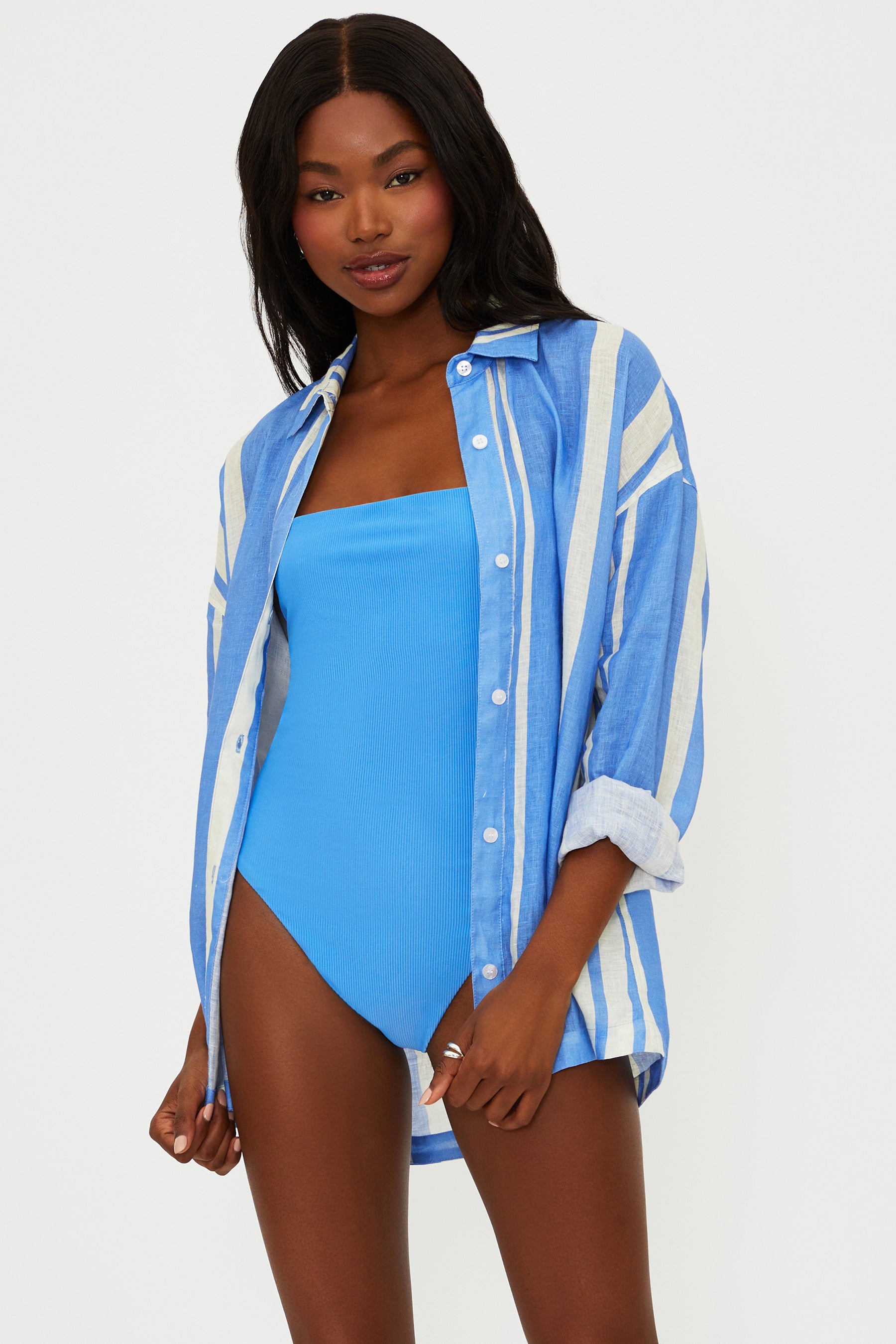 Button down linen shirt with vertical stripes and a collar.