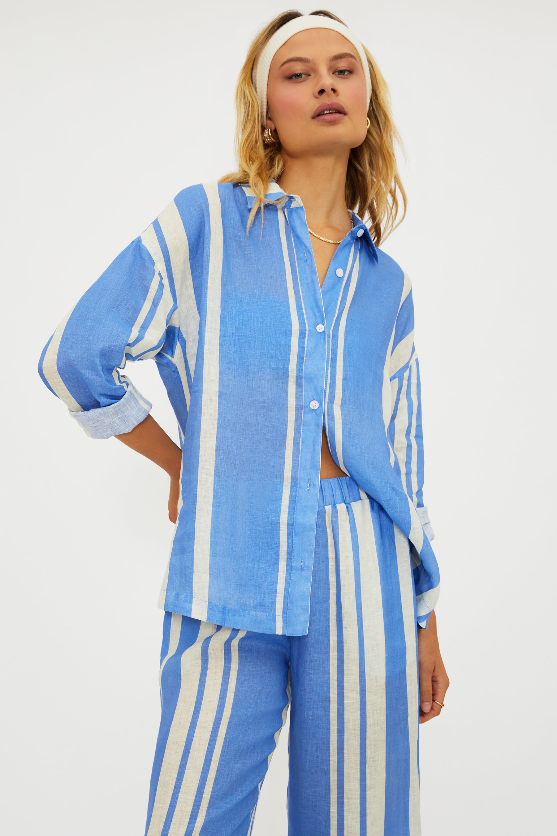 Button down linen shirt with vertical stripes and a collar.