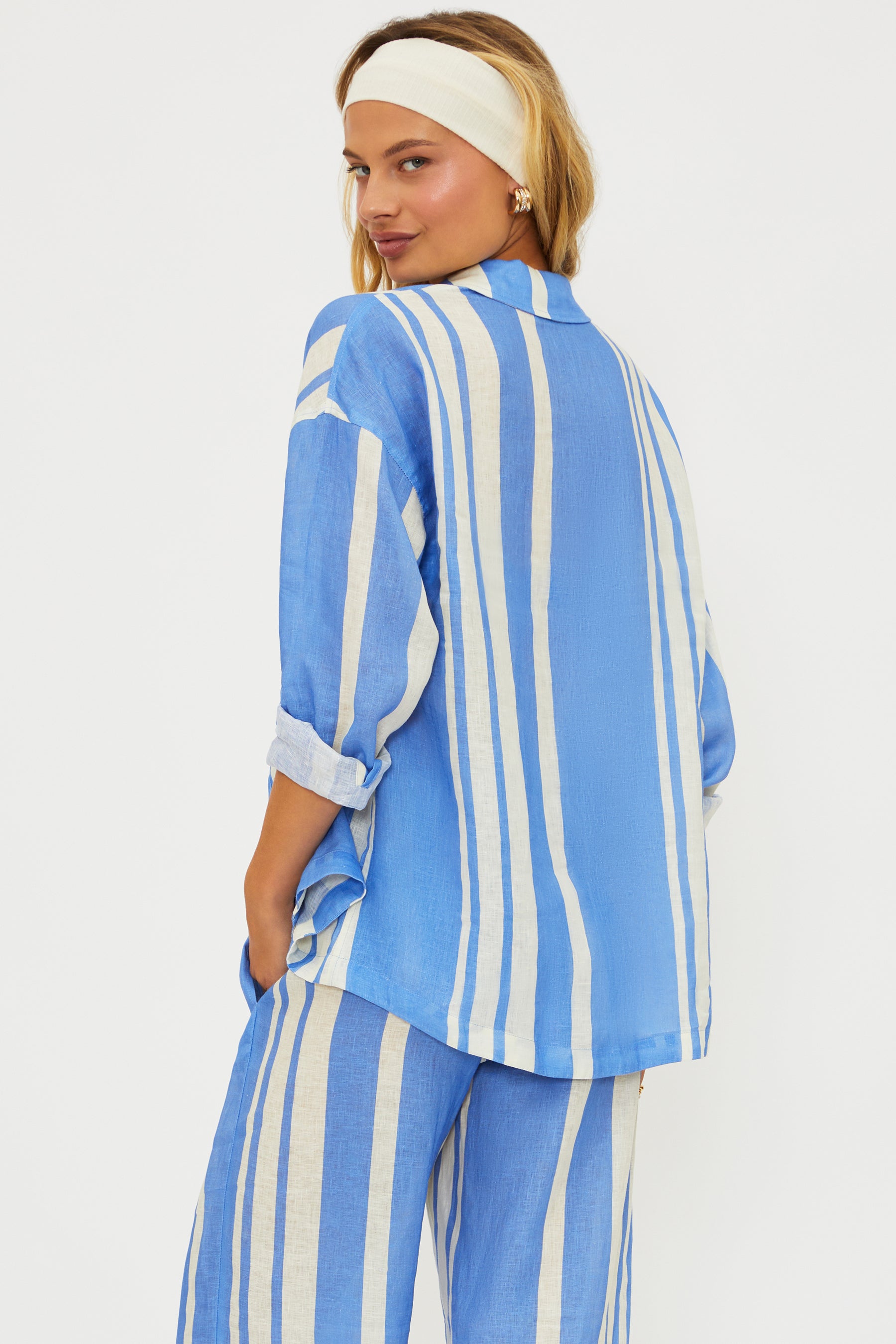 Button down linen shirt with vertical stripes and a collar.