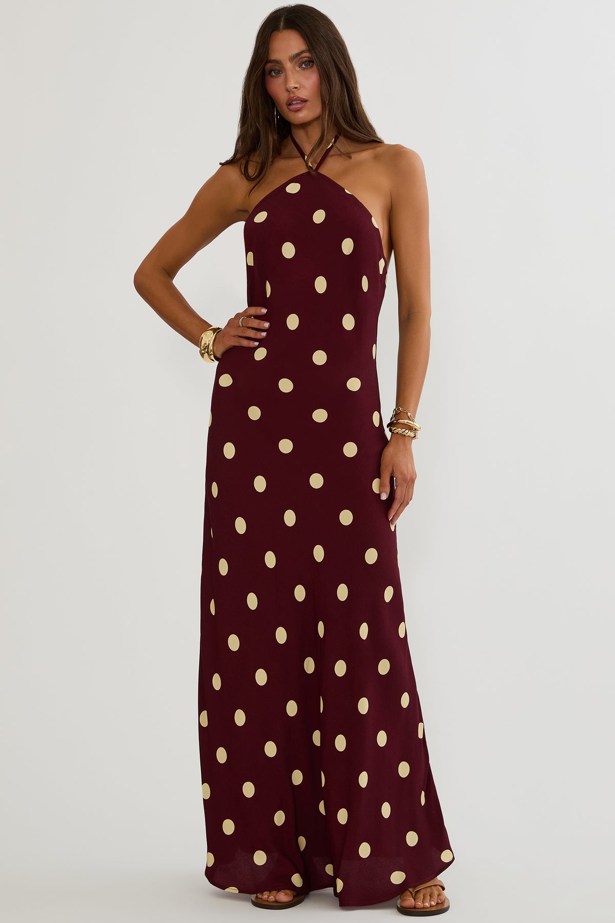 Maxi dress with halter neckline and open back in polka dot print