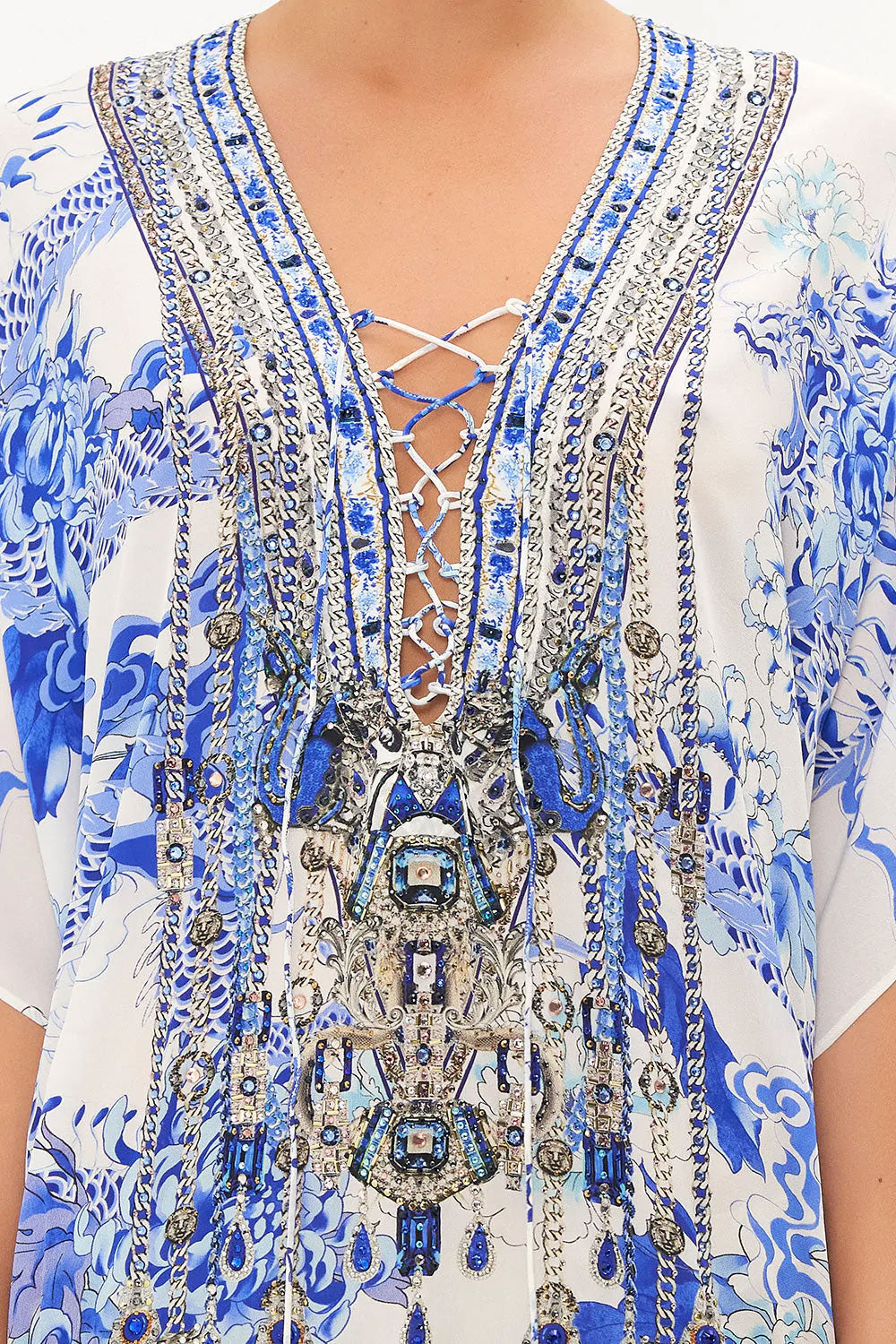 short kaftan dress with lace up center and embellishments down the front