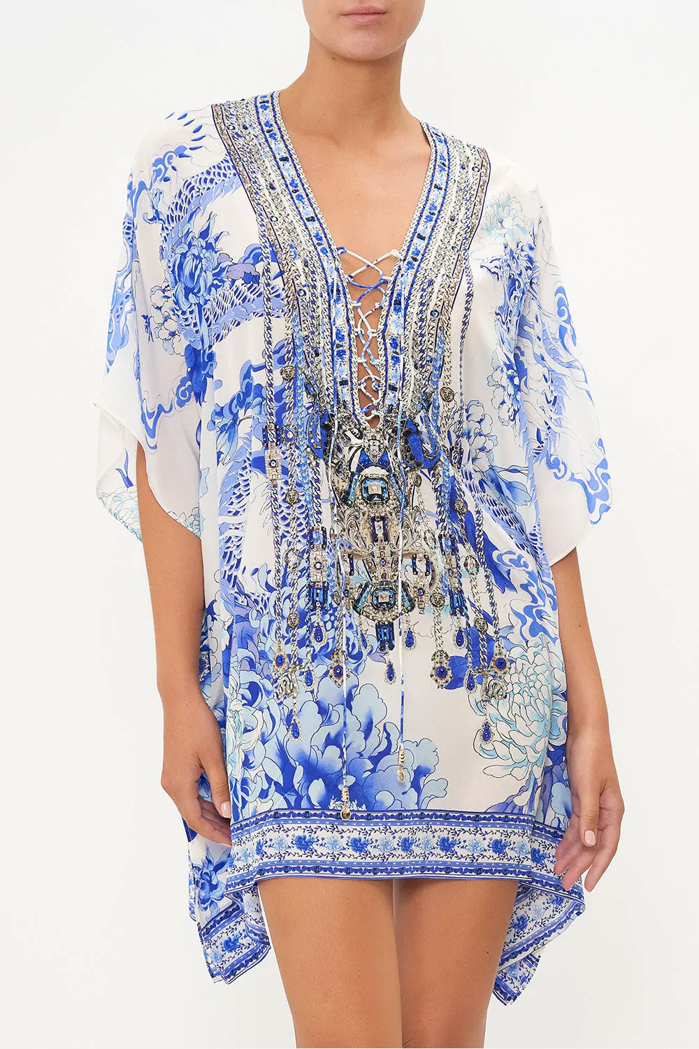 short kaftan dress with lace up center and embellishments down the front