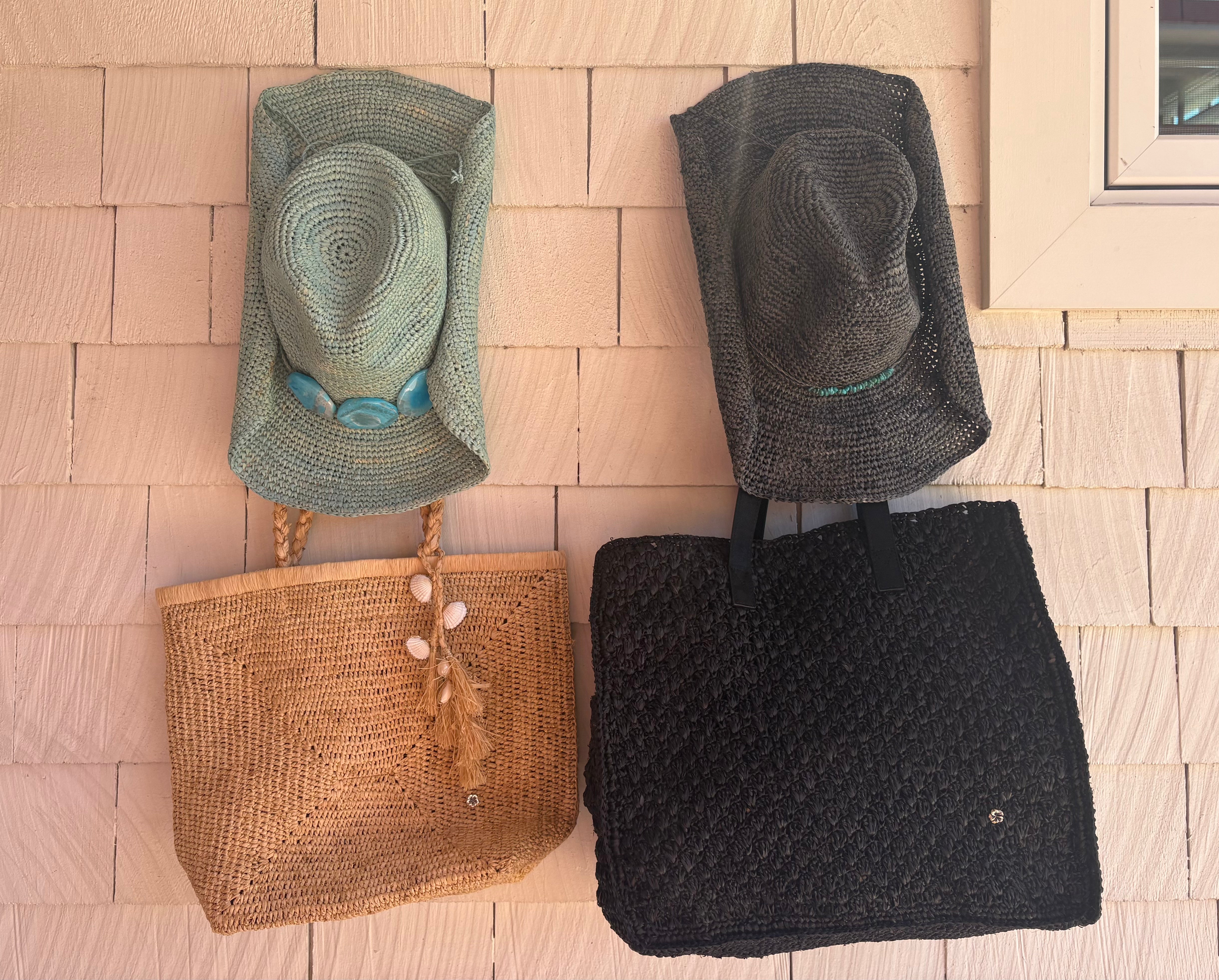 various fashion accessories including a cowboy beach hat, earrings, and sunglasses 