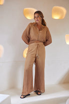 Long flowy pants with elastic waistband and tasseled drawstrings