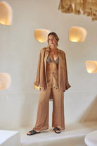 Long flowy pants with elastic waistband and tasseled drawstrings