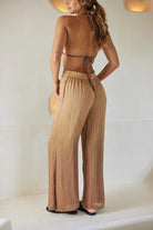 Long flowy pants with elastic waistband and tasseled drawstrings